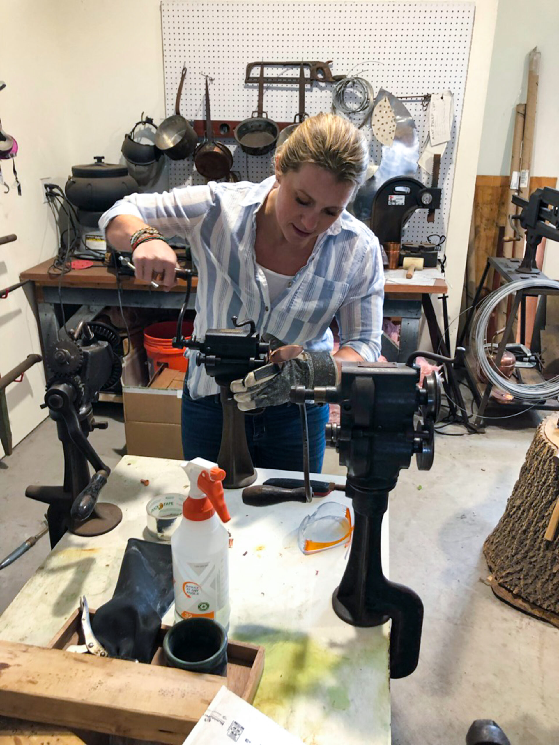 Sara primarily uses hand tools to shape the initial copper form that she will eventually line with molten tin.