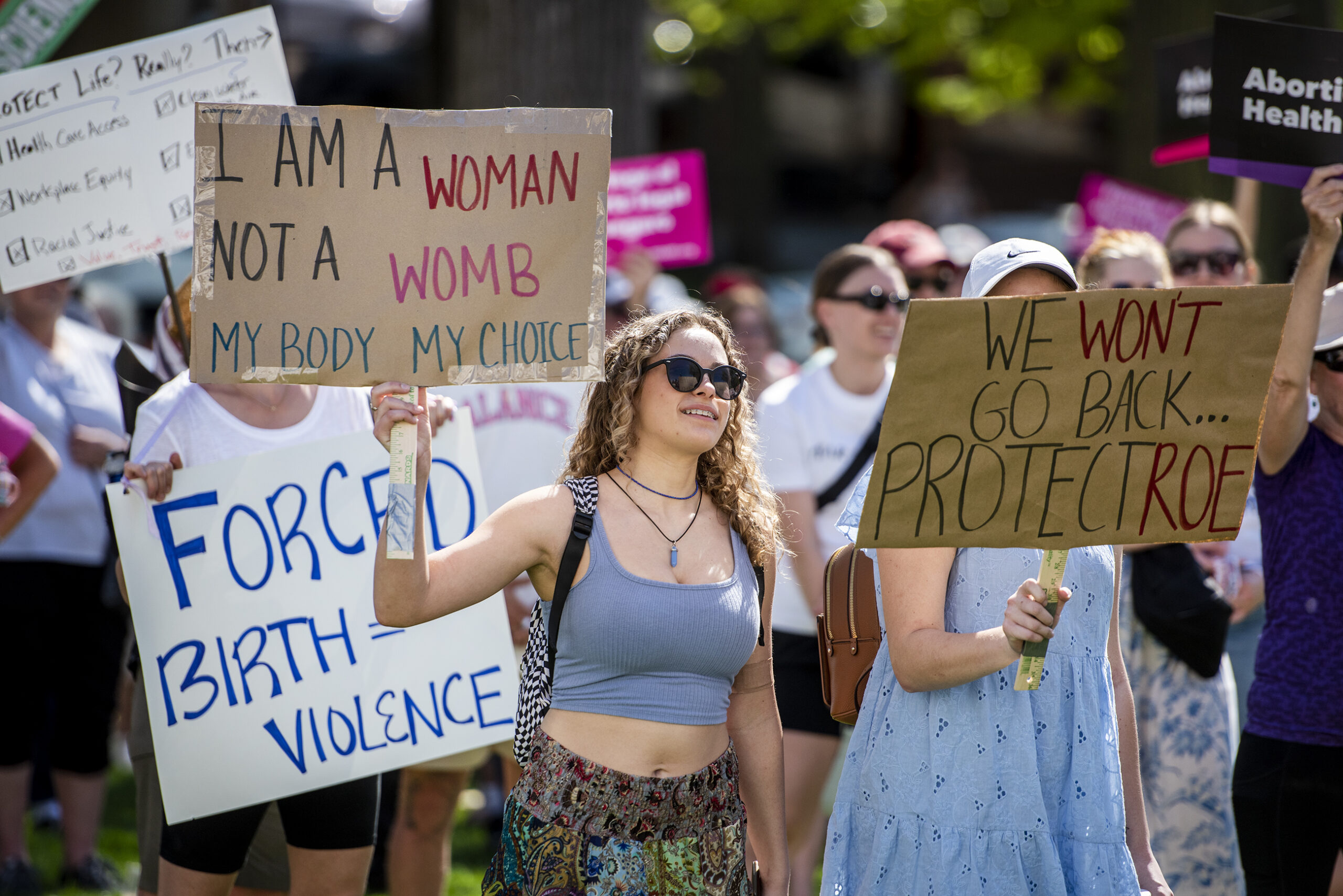 A protester holds a sign that says 