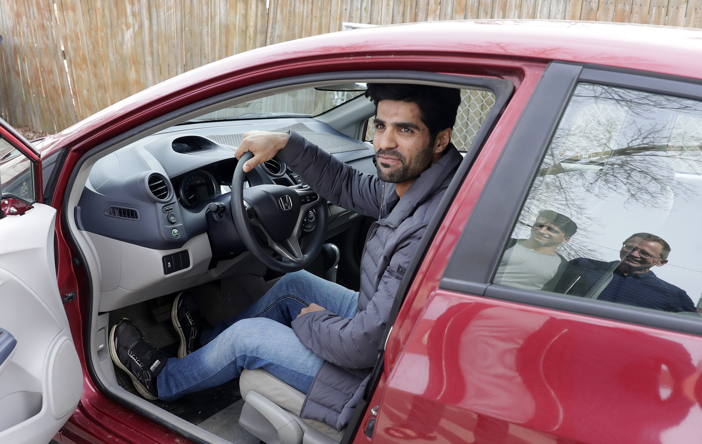 After receiving his driver's license earlier in the year, Ahmad Samim Samimi tests out a vehicle
