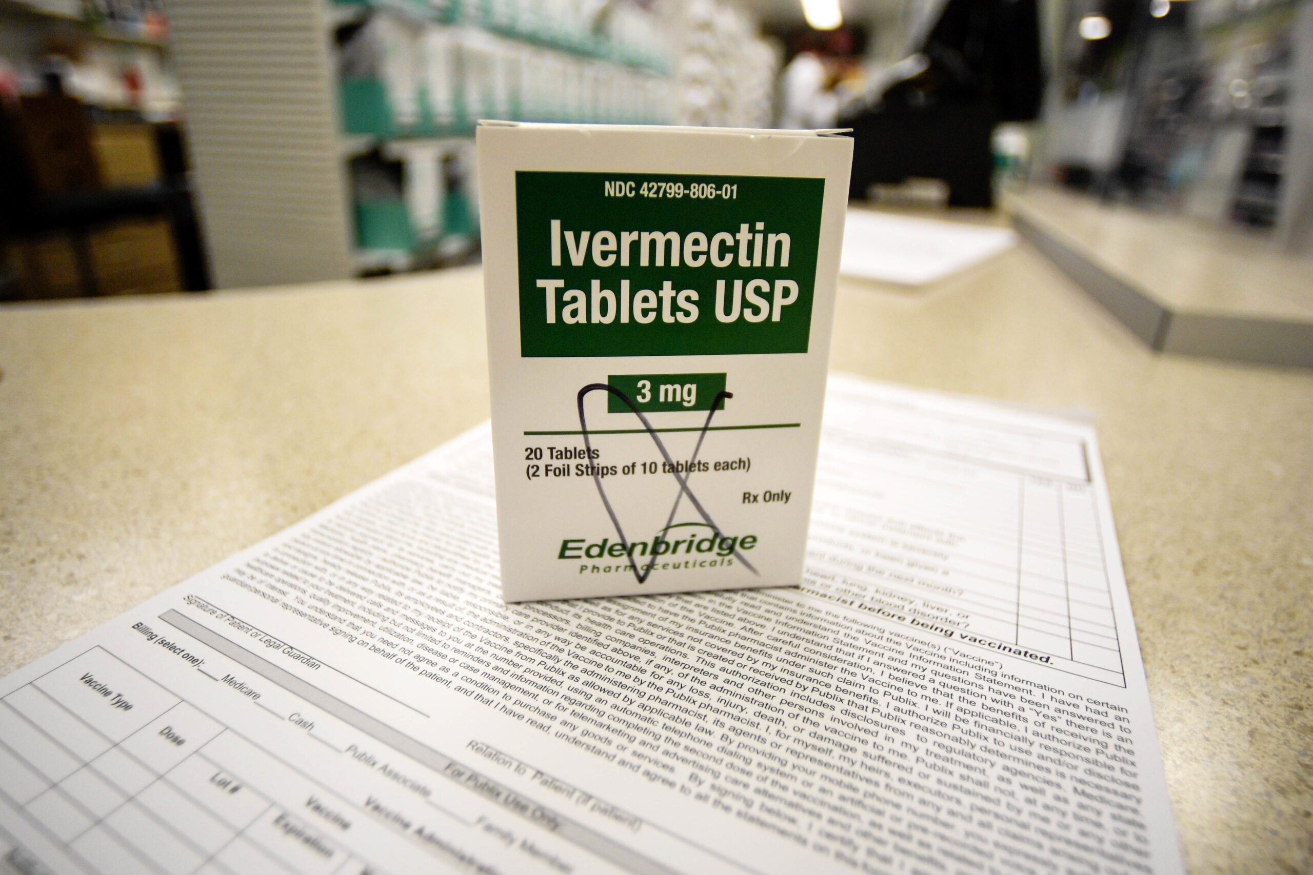 A box of ivermectin is shown in a pharmacy