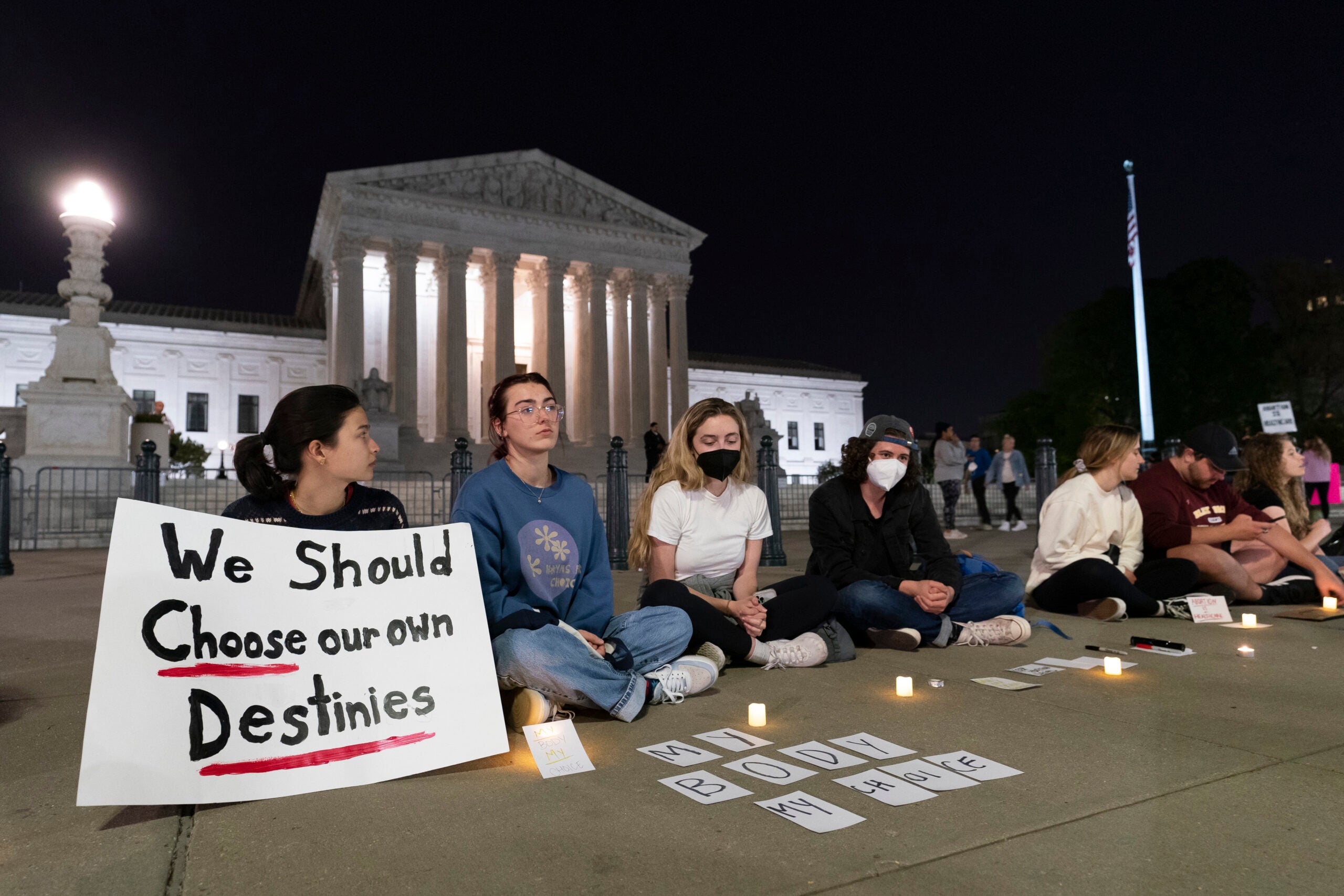 People standing outside the U.S. Supreme Court and protesting anti-abortion