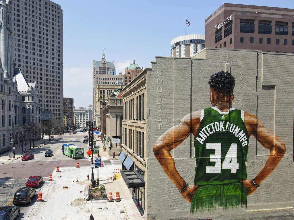 A mural of Milwaukee Bucks' Giannis Antetokounmpo on the side of a Milwaukee building