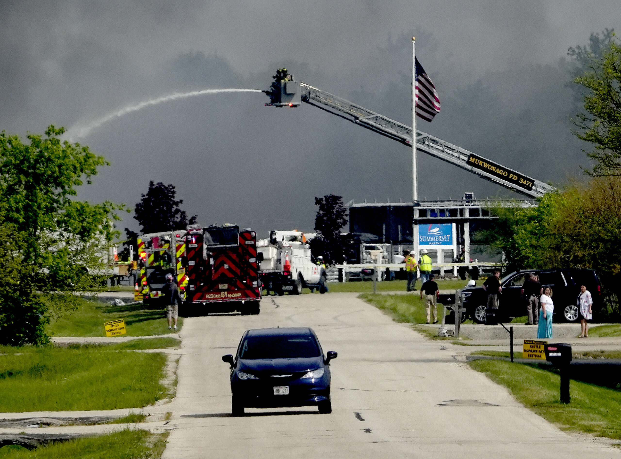 Emergency crews work to extinguish a fire at Summerset Marine Construction in Eagle