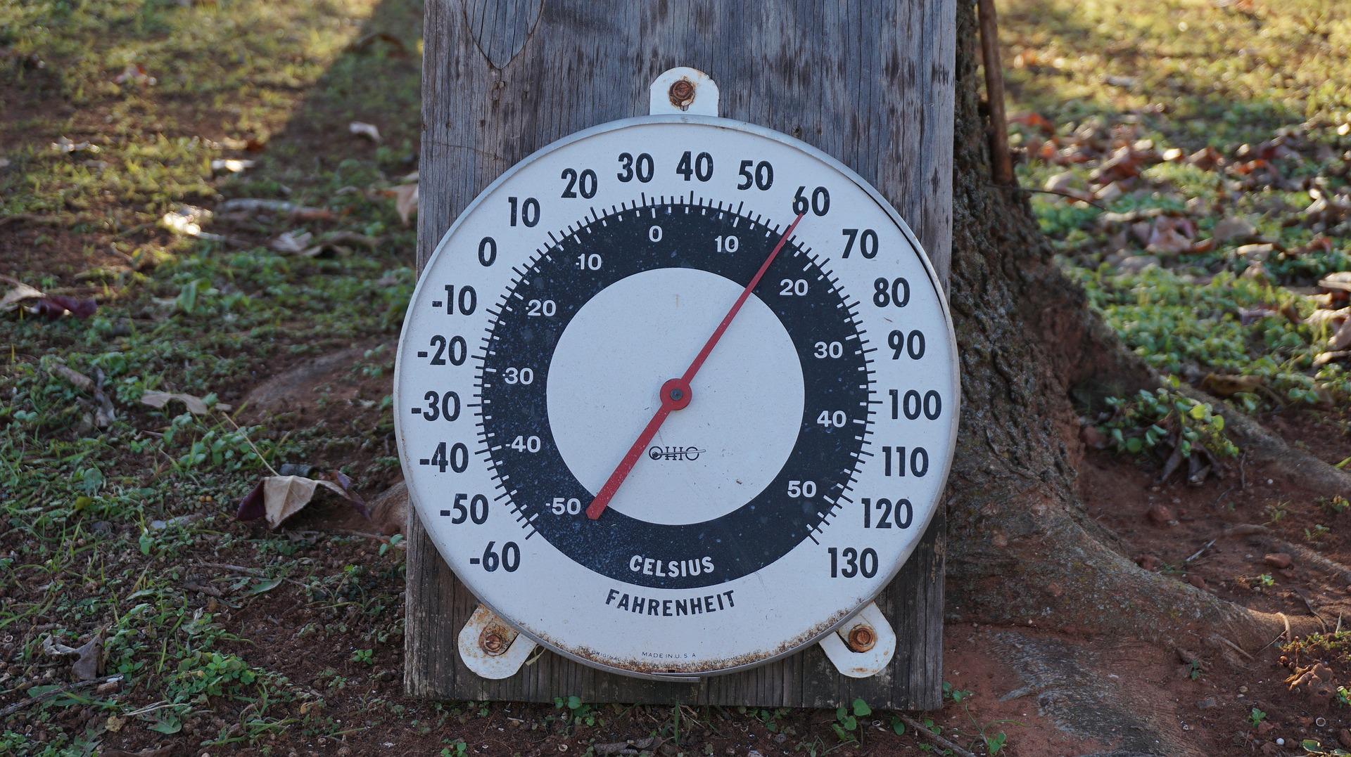 Outside thermometer attached to board.
