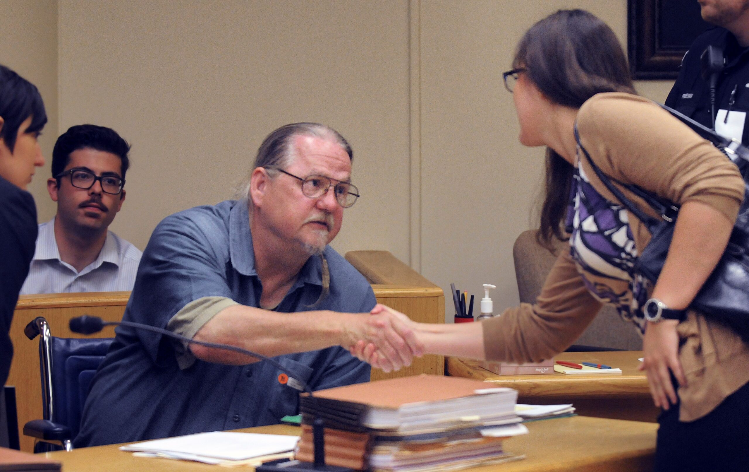 Joseph Frey shakes hands with University of Wisconsin law student Lauren Devine