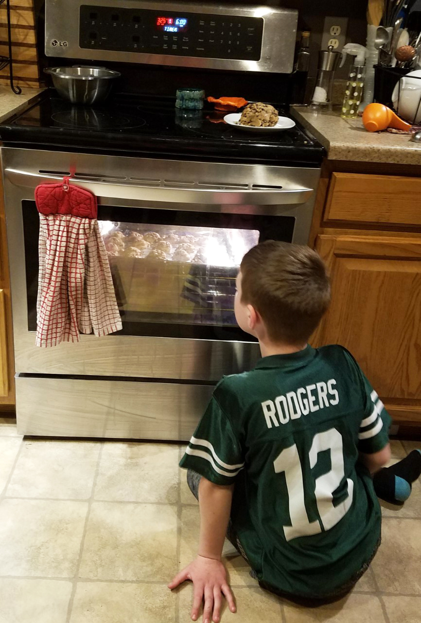 Benson Foust watching cookies bake