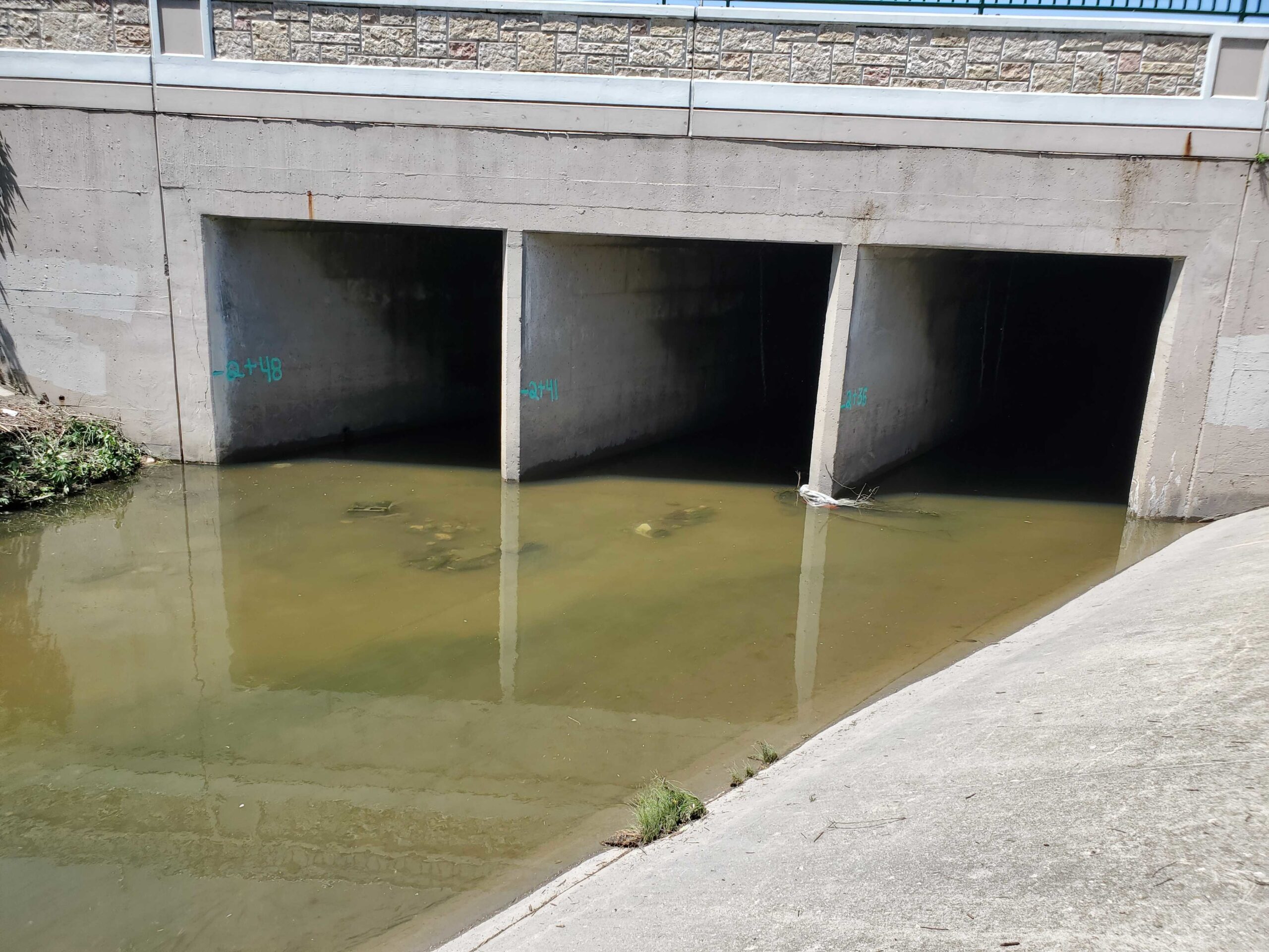 Three people were swept away in high waters in a drainage ditch that empties into Milwaukee's Kinnickinnic River. 