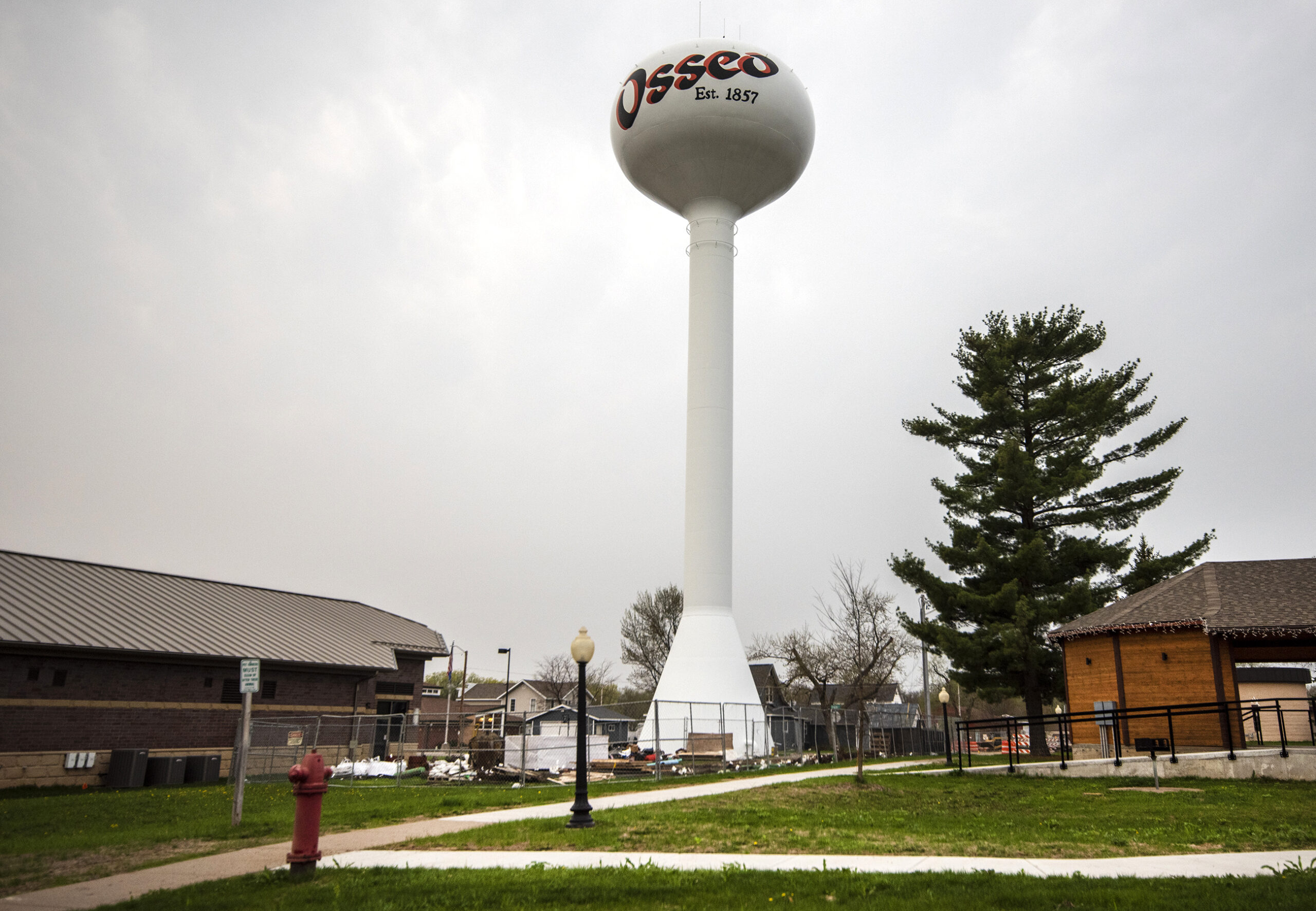 A white water tower has "Osseo" written on it.