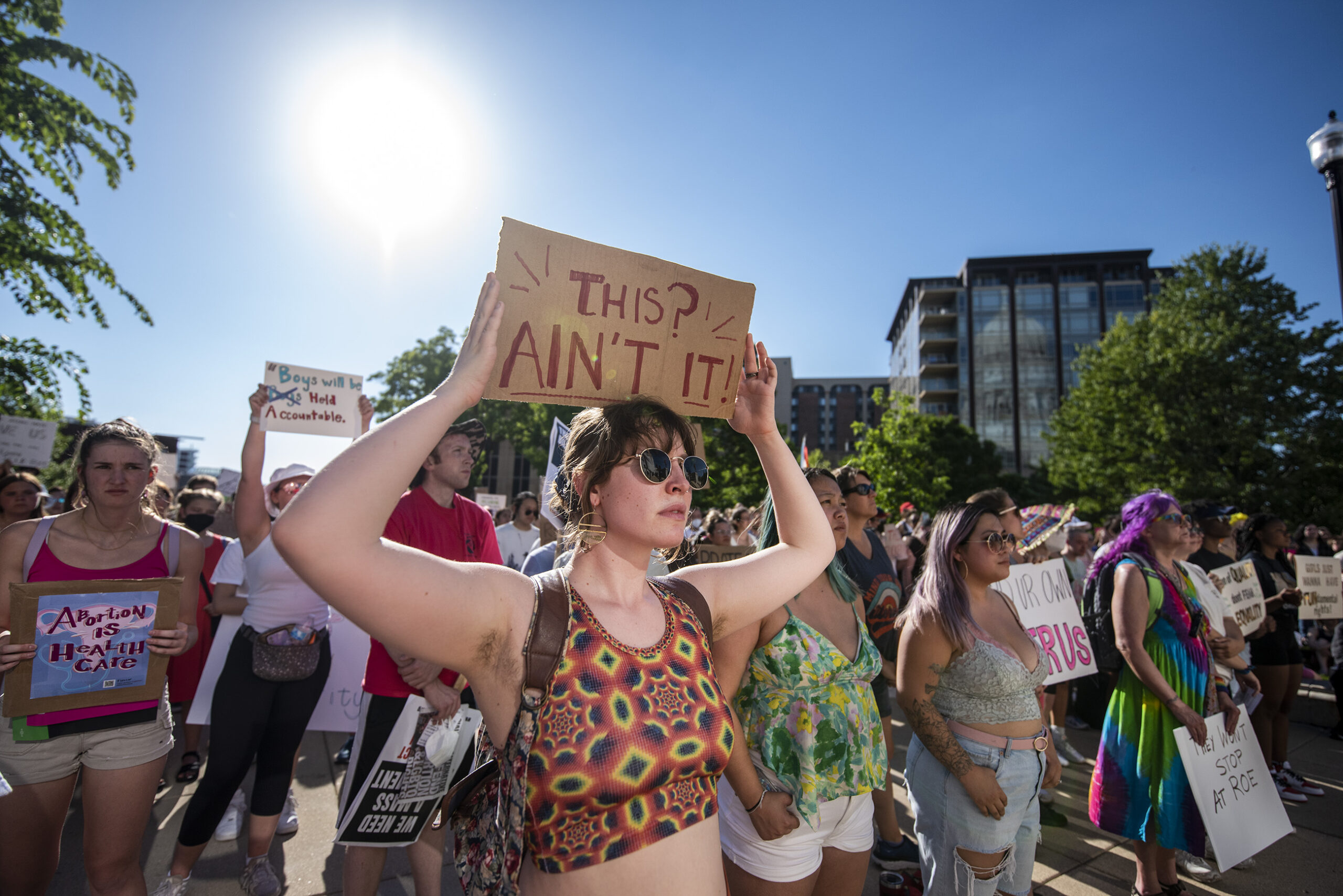 A protester holds a sign that says 