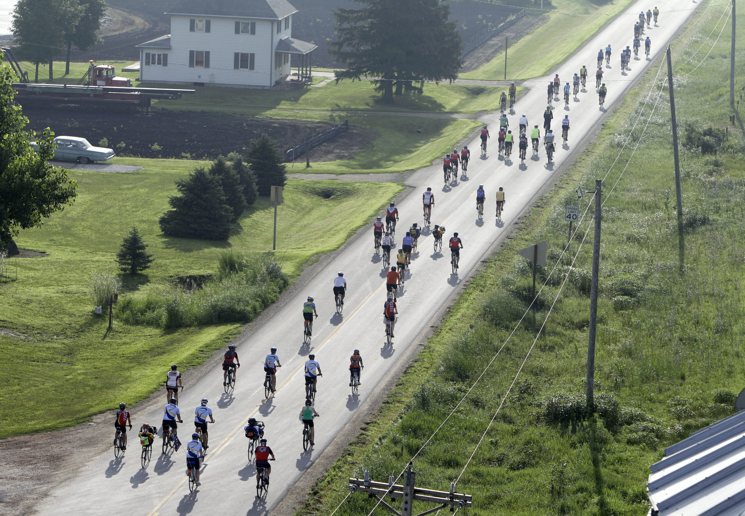 Cyclists leave Lidderdale, Iowa, on the RAGBRAI course in 2011.