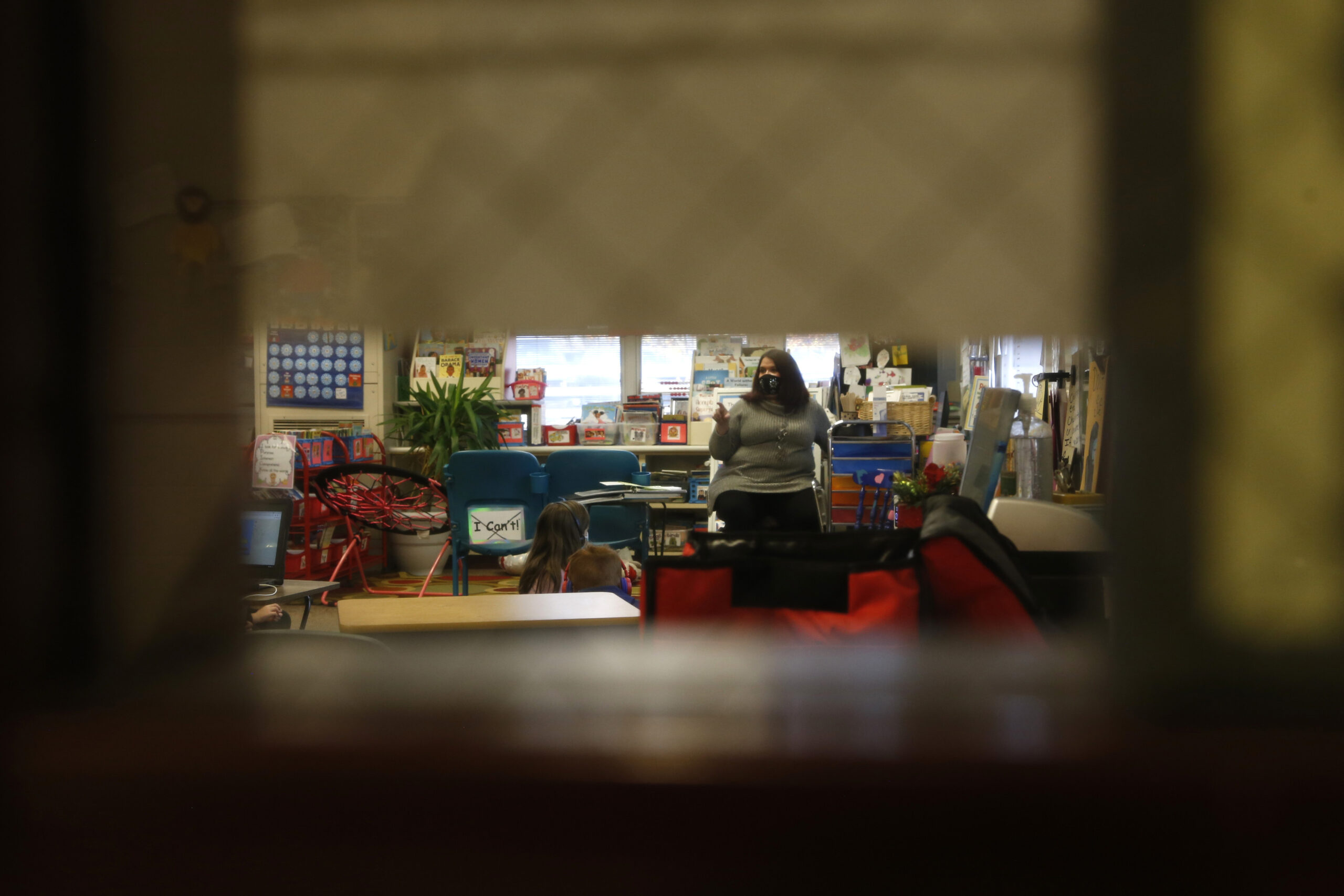 Second-grade teacher Melissa Shugg, seen through her classroom door