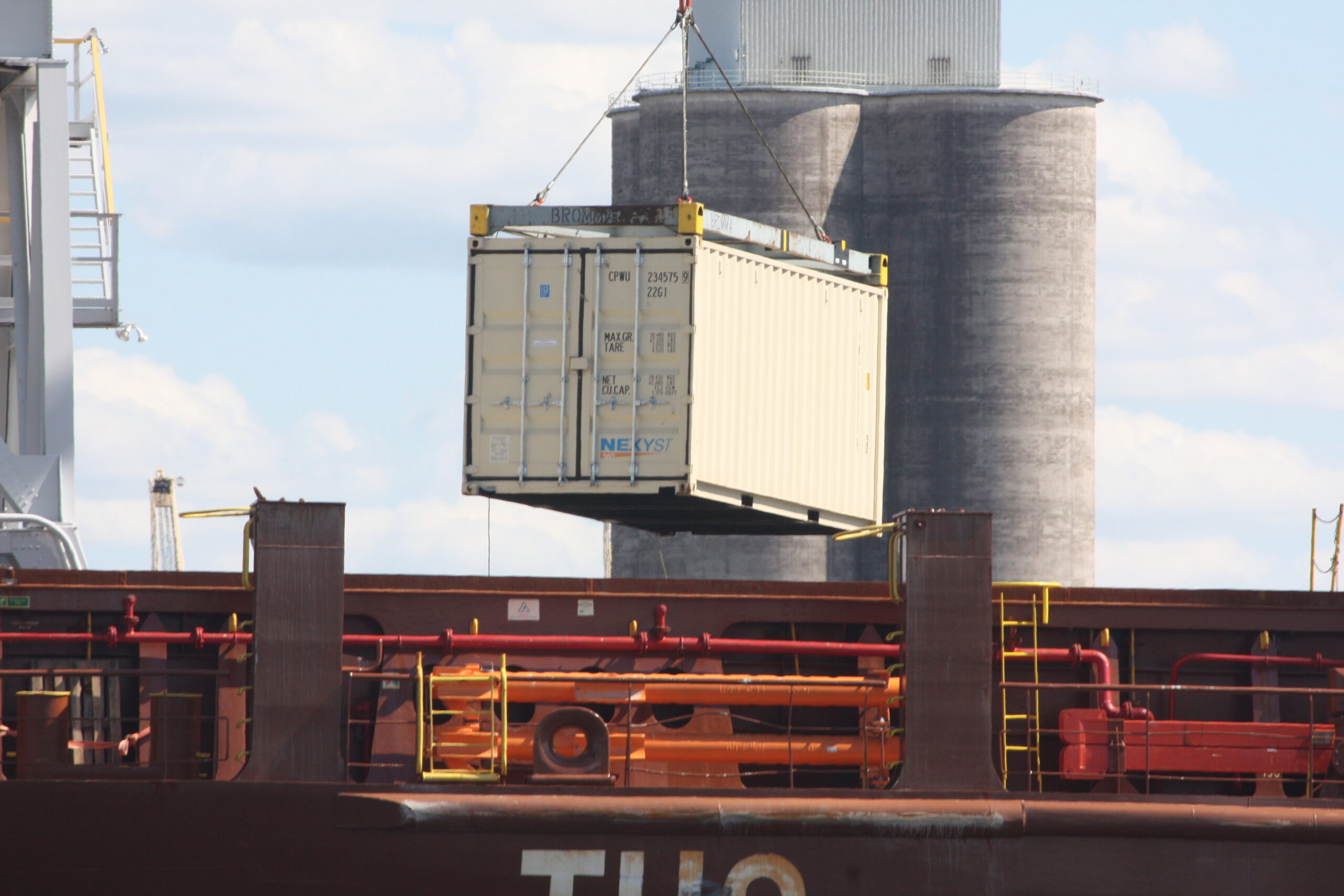 shipping container loaded onto ship