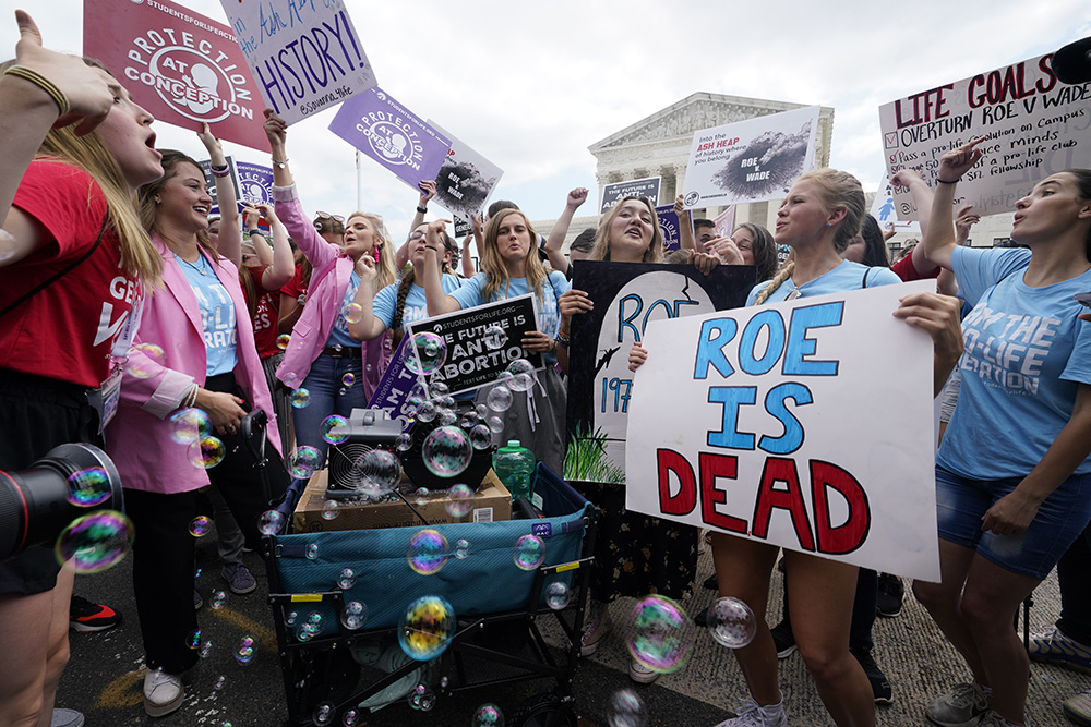 A celebration outside the Supreme Court, Friday, June 24, 2022, in Washington