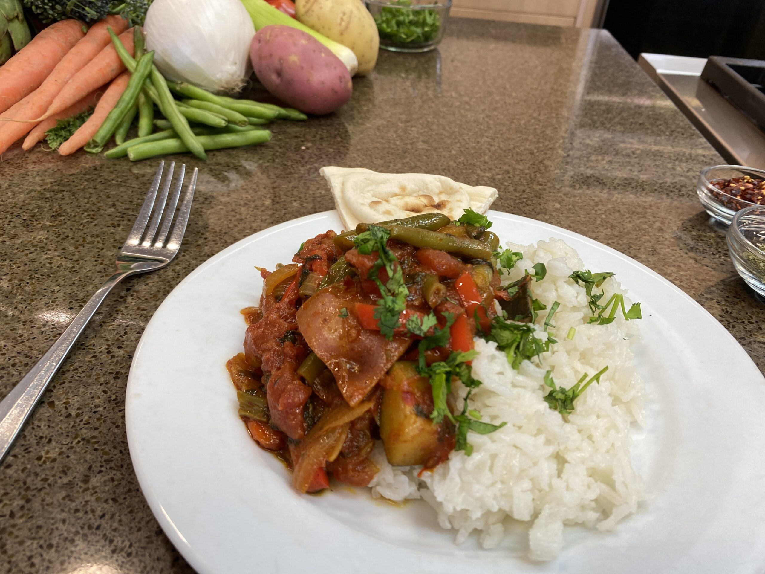An Afghan-style vegetable korma dish, prepared with rice and naan