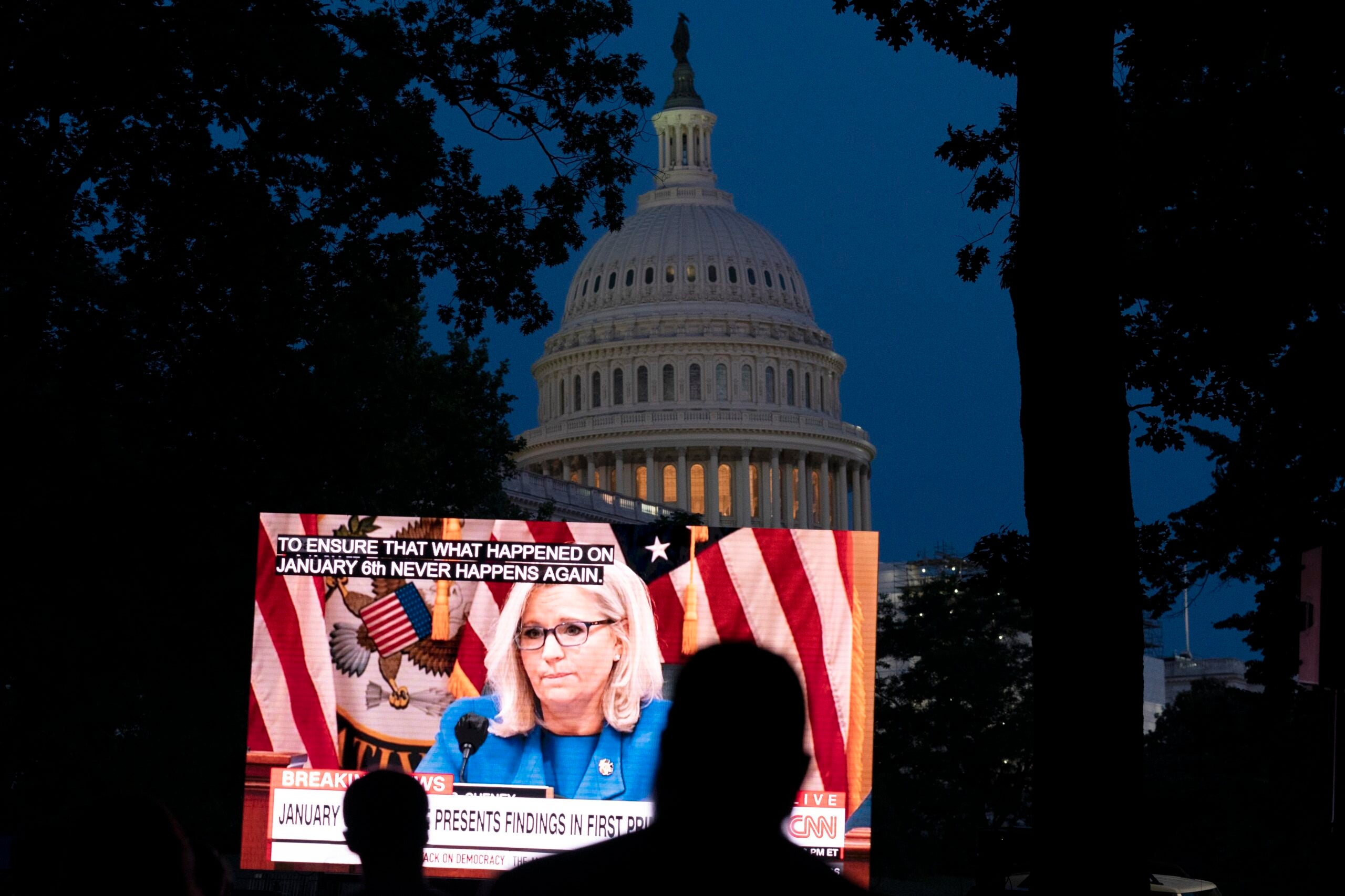 People watching the televised Jan. 6 hearings outside of the U.S. Capitol