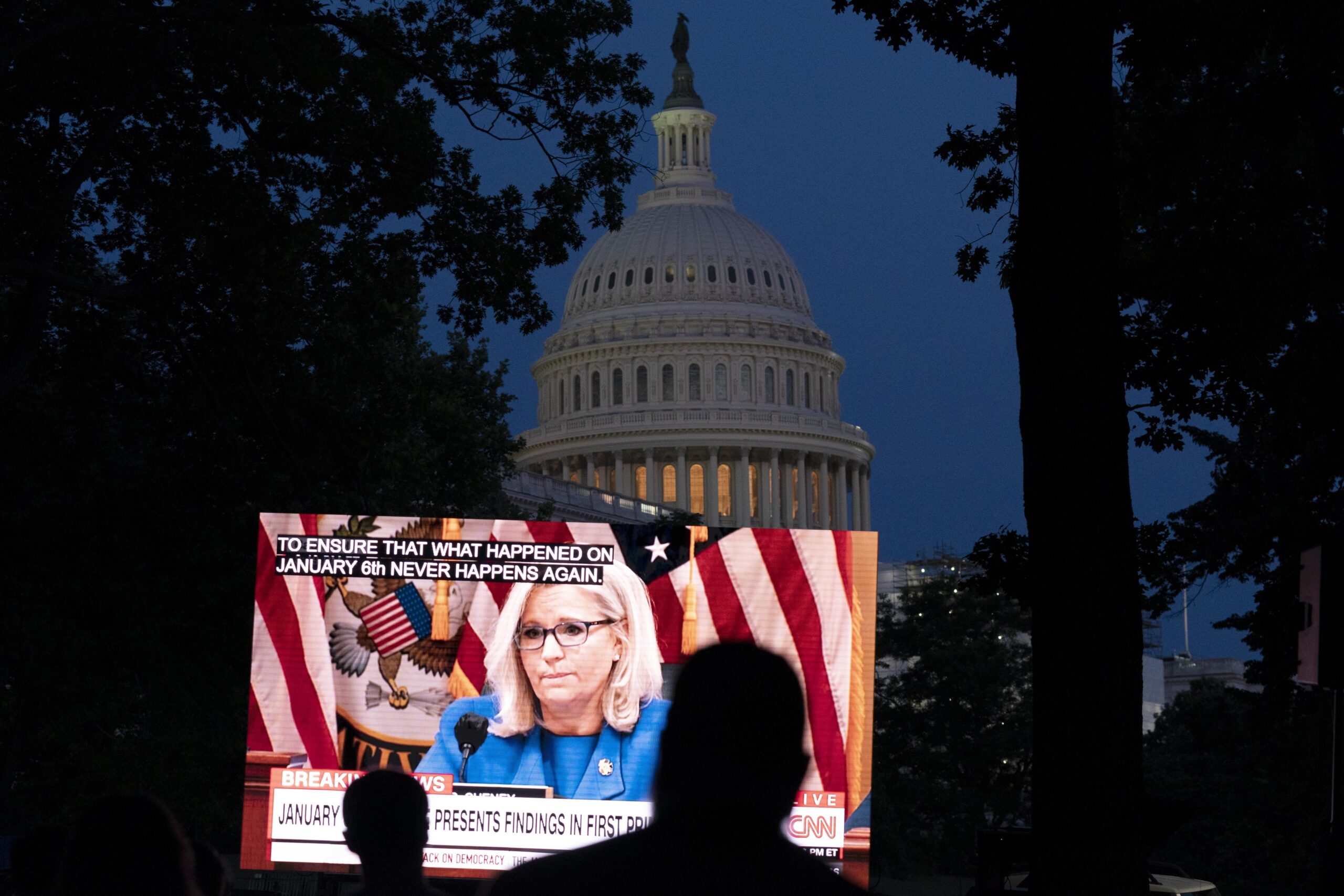 People watching the televised Jan. 6 hearings outside of the U.S. Capitol