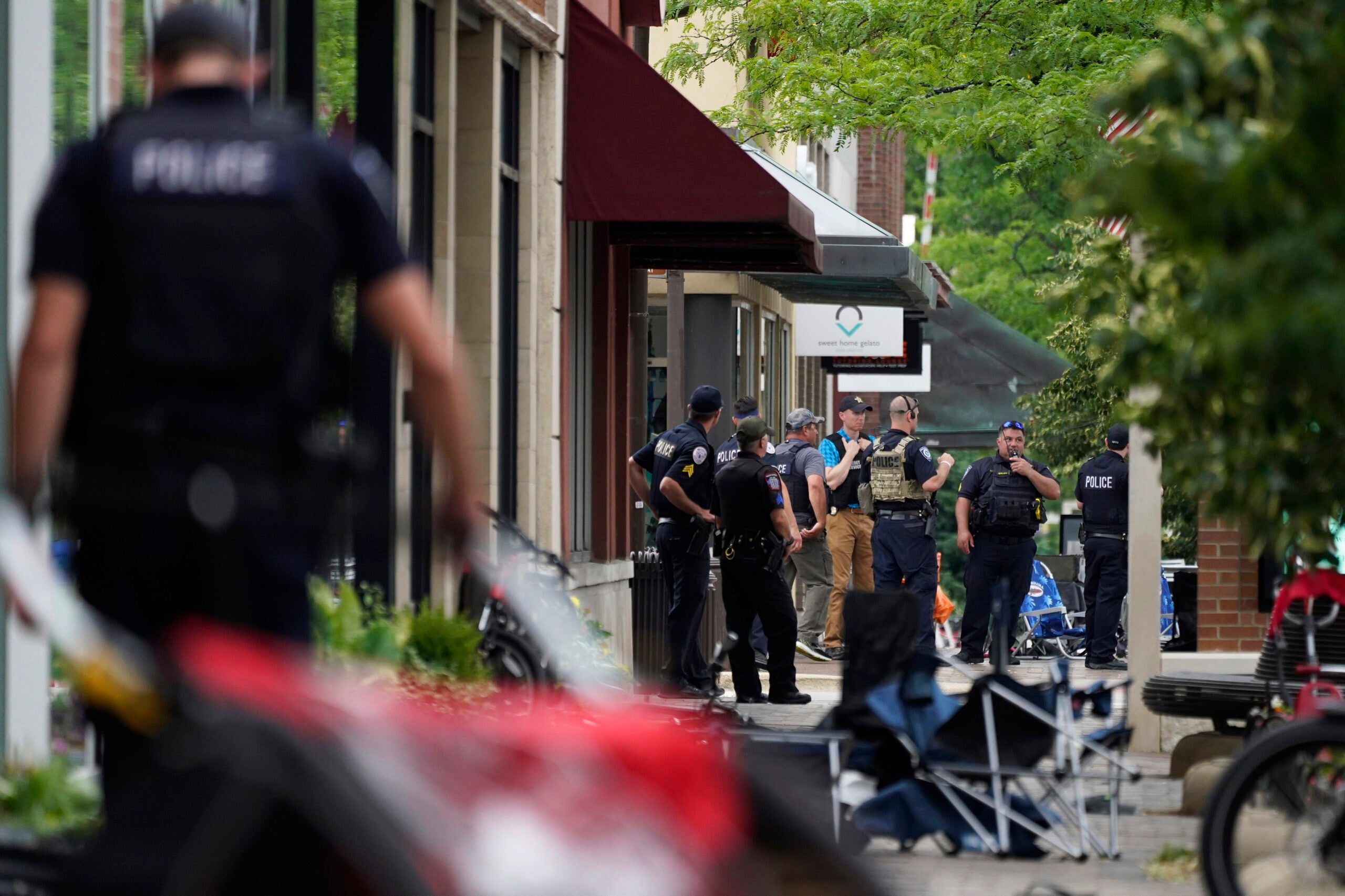 Law enforcement search after a mass shooting at the Highland Park Fourth of July parade