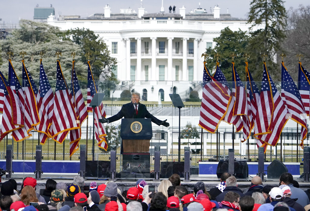 With the White House in the background, President Donald Trump speaks at a rally in Washington