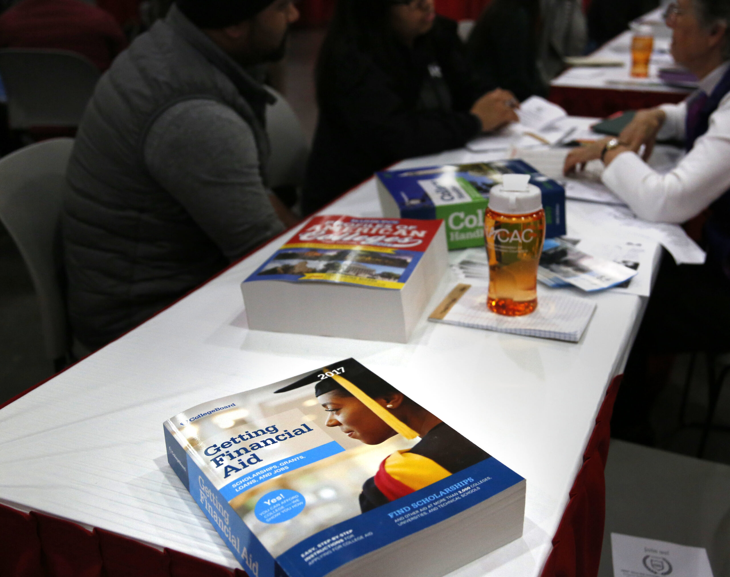 A book about financial aid is seen at a college fair in New York