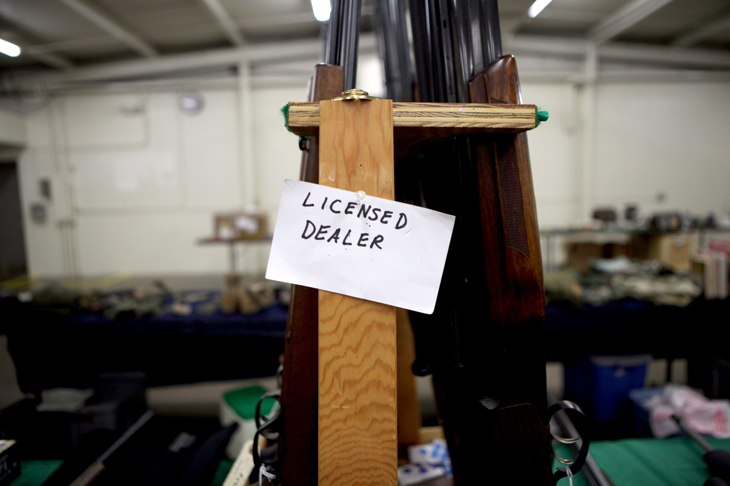 A tag at Ron Martin's booth at the Badger Military Collectible Show in Waukesha, Wis., in 2016 identifies him as a licensed gun dealer