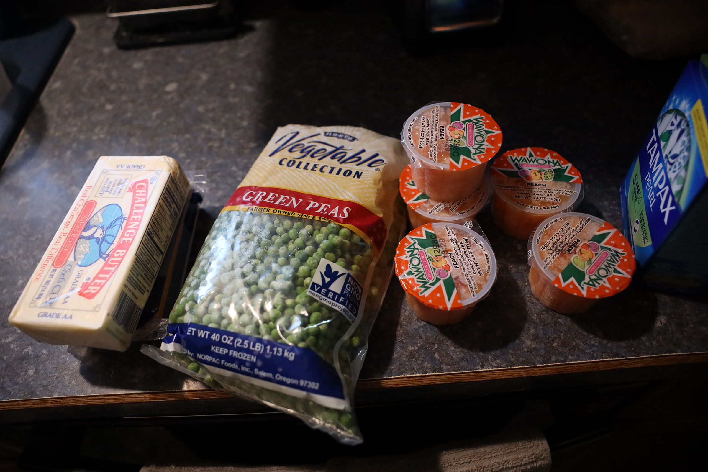 Groceries sit on a kitchen counter