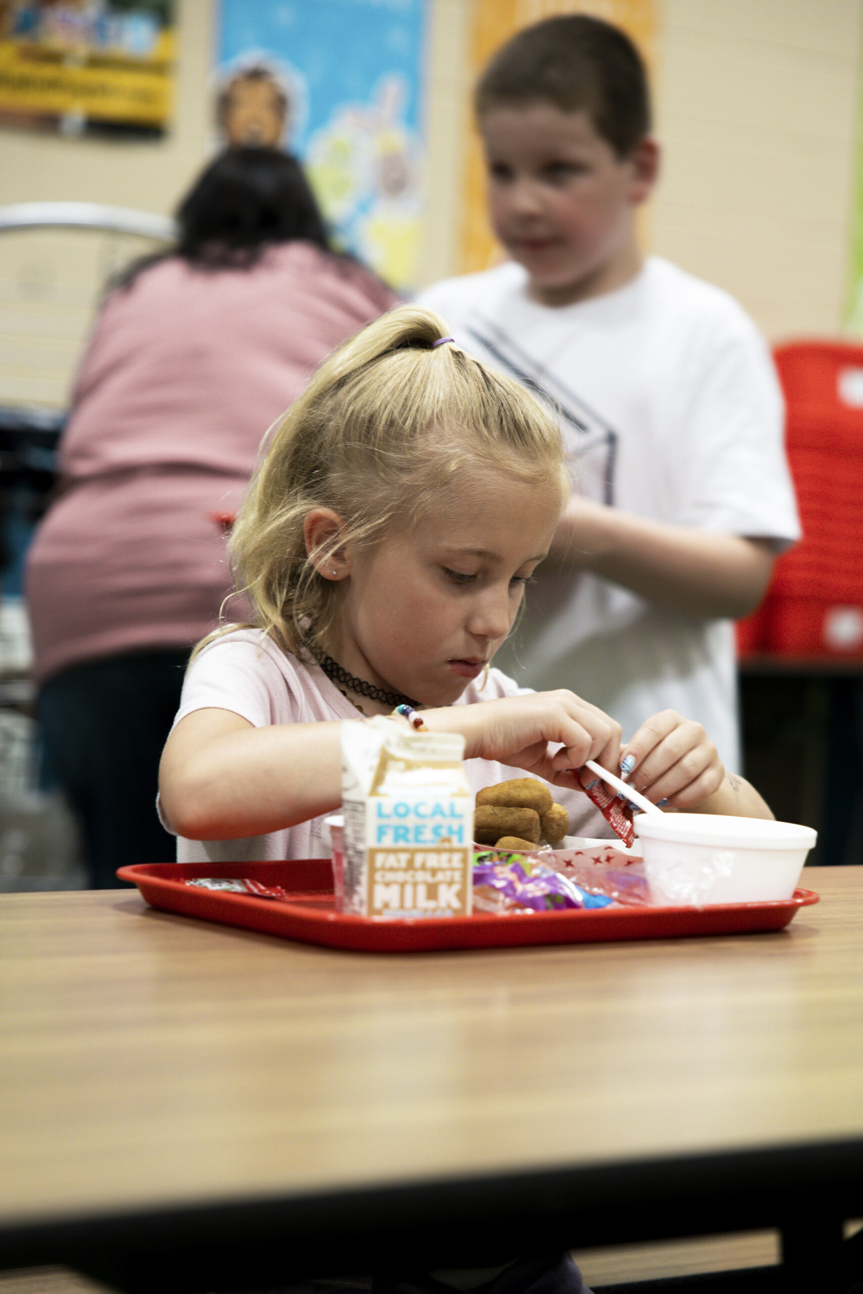 A child eats lunch at school