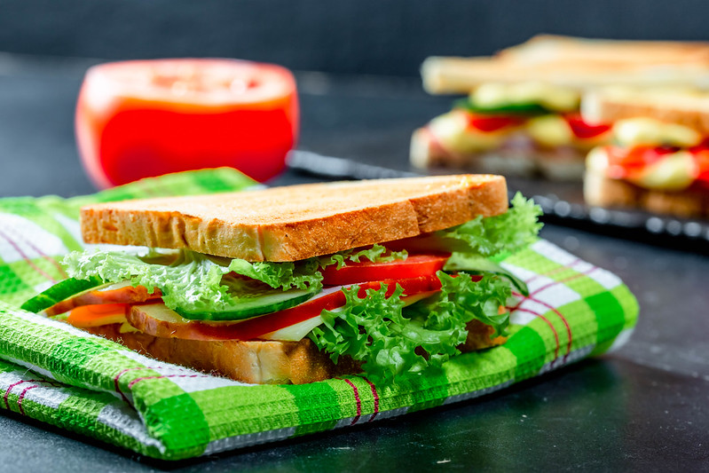 A veggie sandwich on a napkin