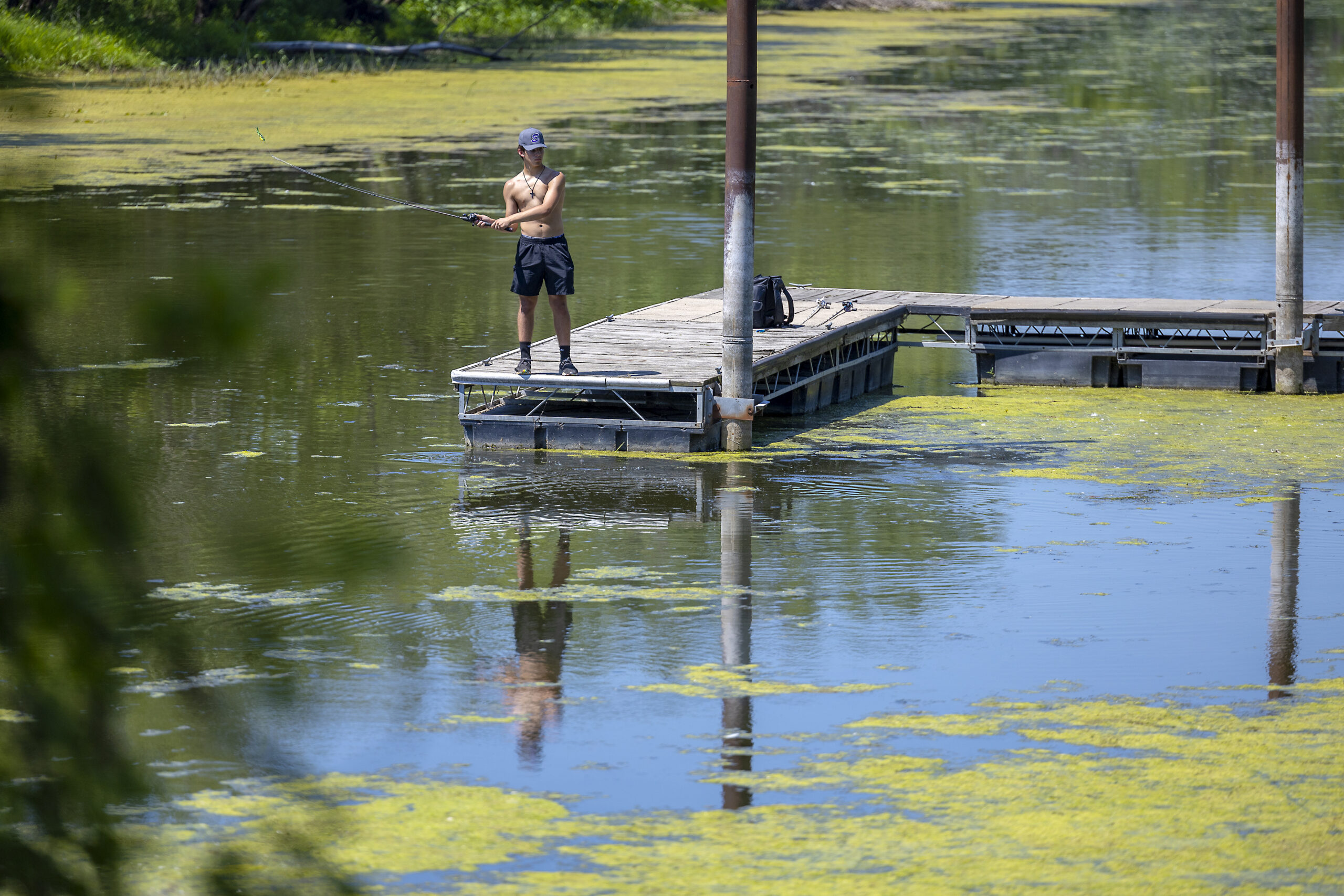 Weeds grow in an area that is making it difficult (or impossible) for boats to get through in Bay City