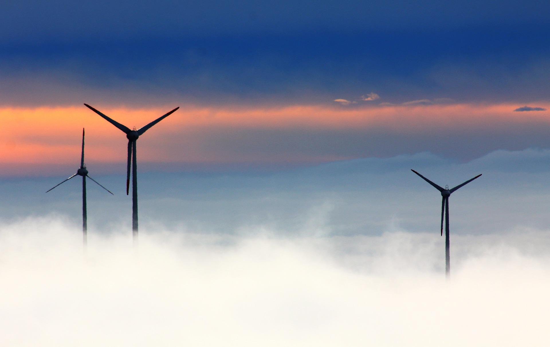 three windmills in the clouds