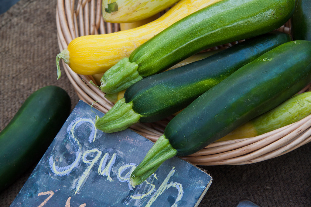 A basket of zucchini and summer squash
