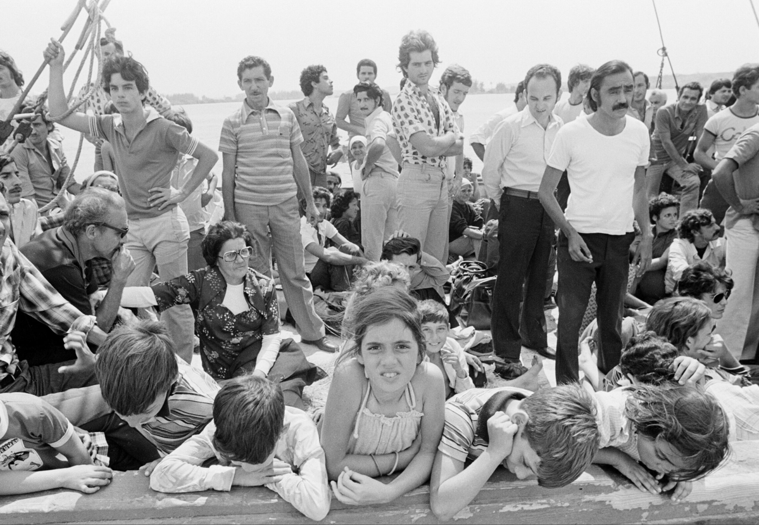Cuban refugees wait aboard a boat at the port of Mariel