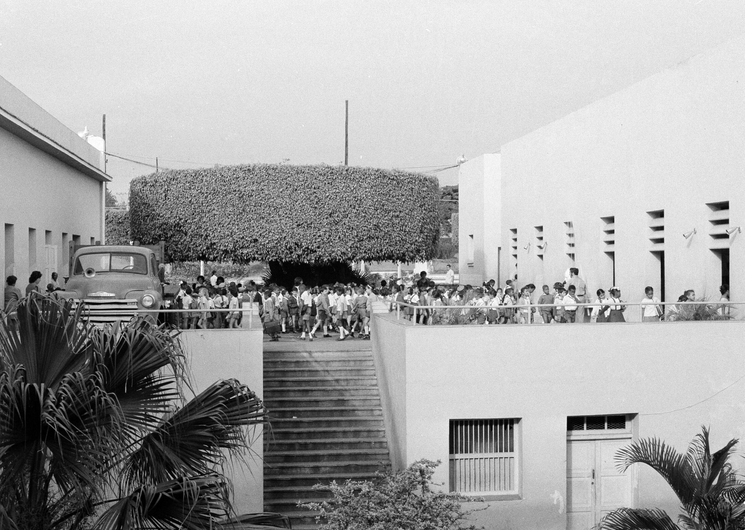Cuban school children crowd around the entrance to their school in Santiago, Cuba, April 5, 1977