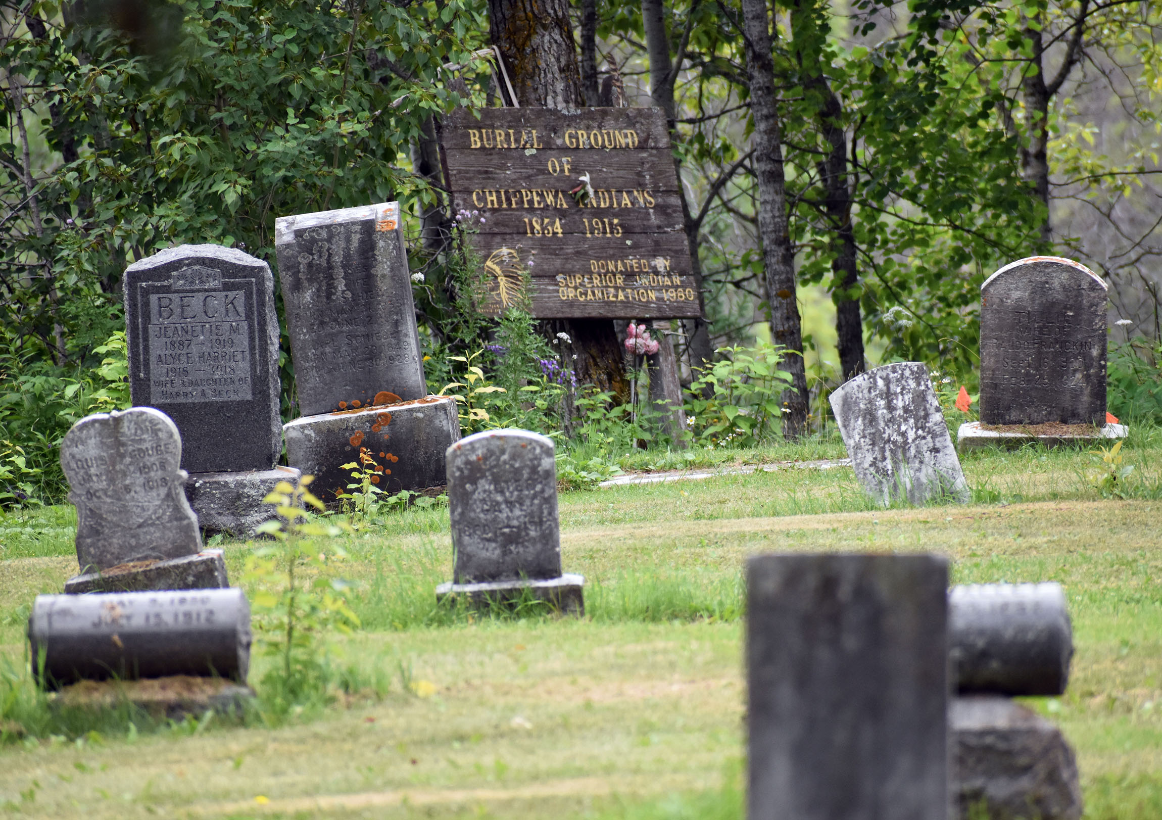 Sign marks burial site of mass graves where Ojibwe remains were reburied