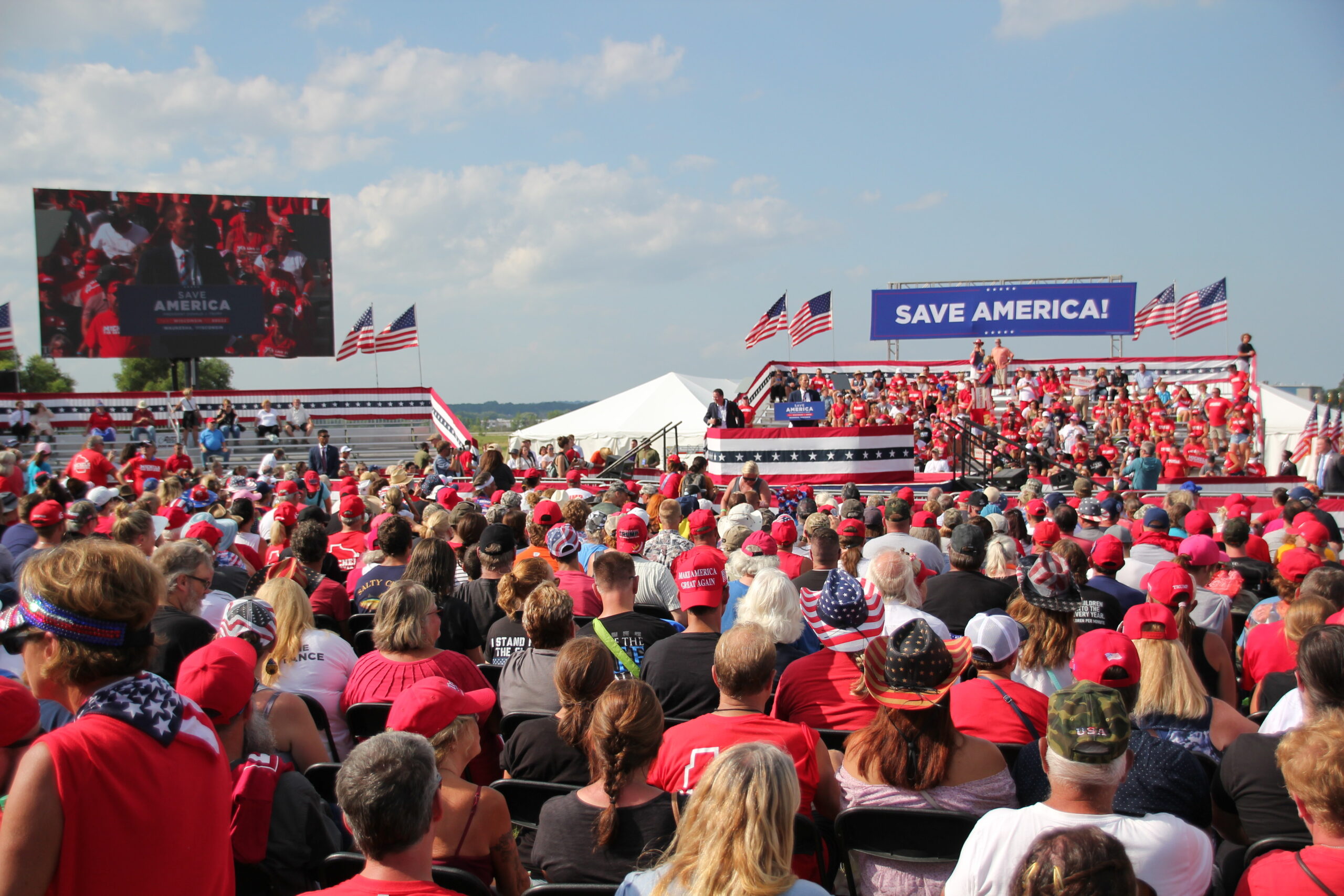 Republican Adam Steen speaks to a crowd of people at a rally for Donald Trump in Waukesha. Trump has endorsed Steen in his Republican primary race against Assembly Speaker Robin Vos.