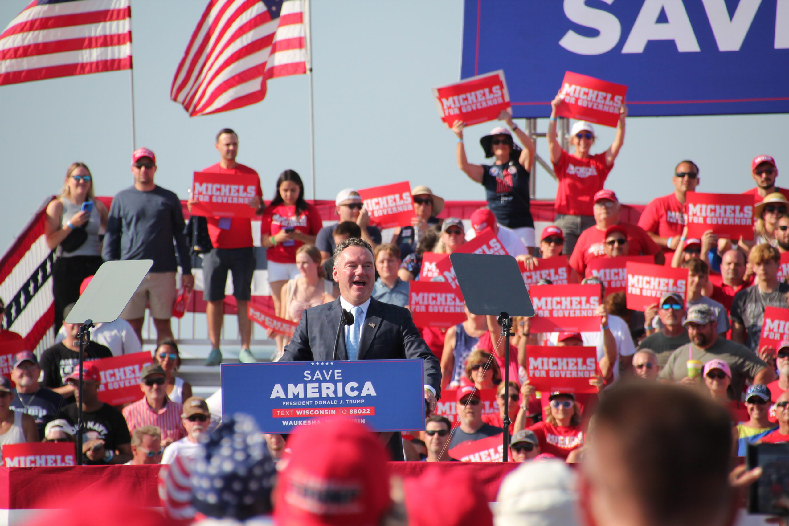 Republican Tim Michels speaks to a crowd at a Waukesha rally organized by former President Donald Trump. Trump endorsed Michels in the Republican primary for governor.