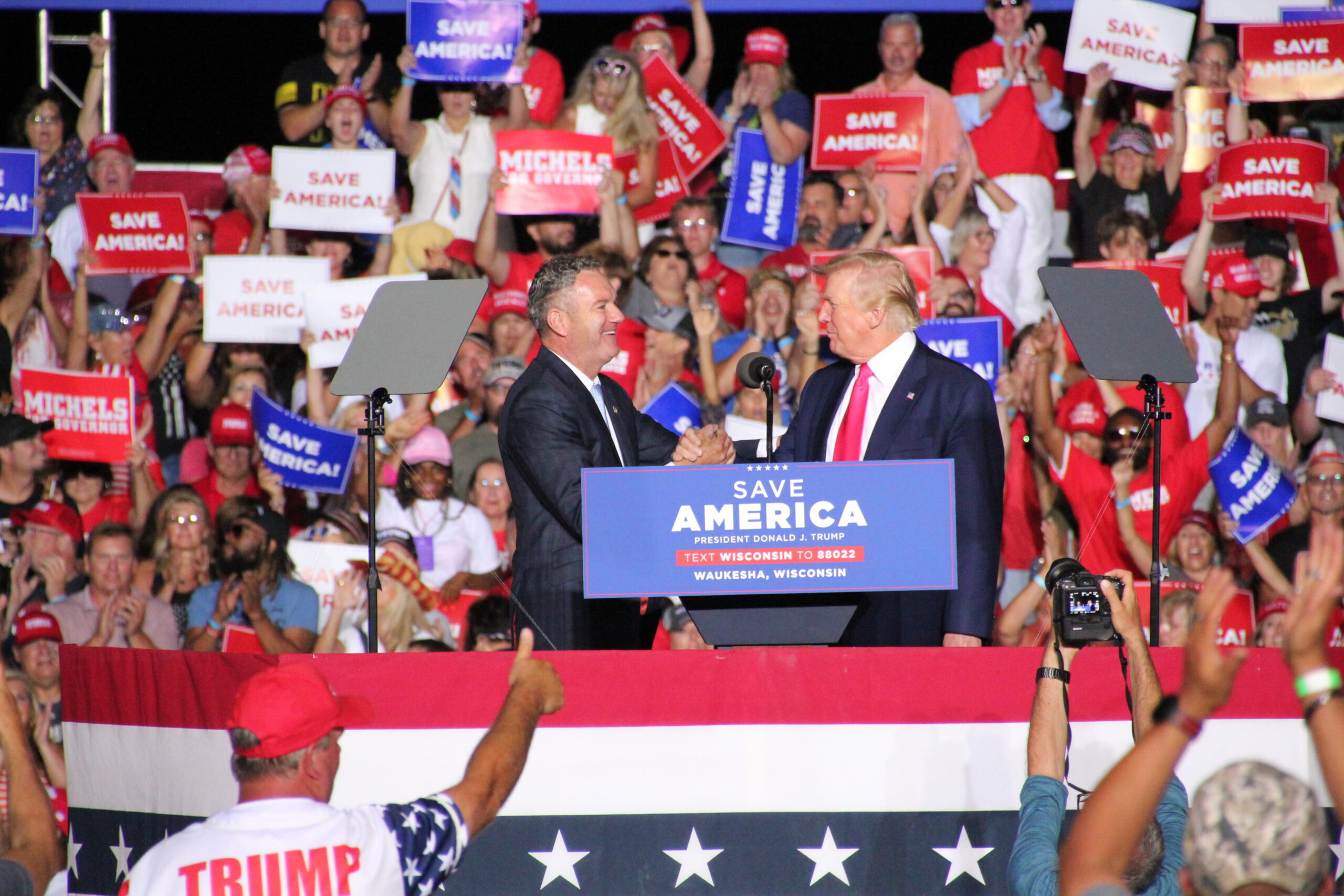 Republican candidate for governor Tim Michels shakes hands with former President Donald Trump at a Waukesha campaign rally on Aug. 5, 2022. Trump endorsed Michels in the Republican primary for governor.
