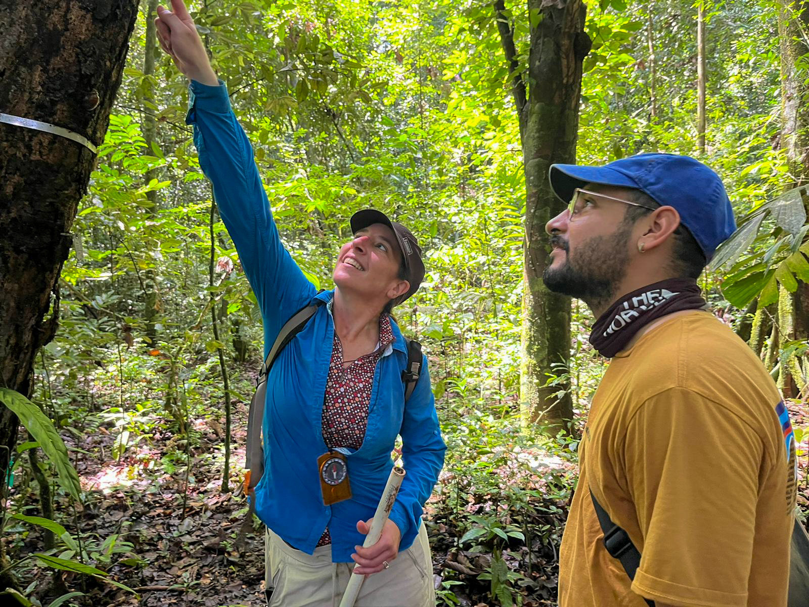 Sarah Oszuscik shows Blas Antimo Perez a discovery in the tree above.