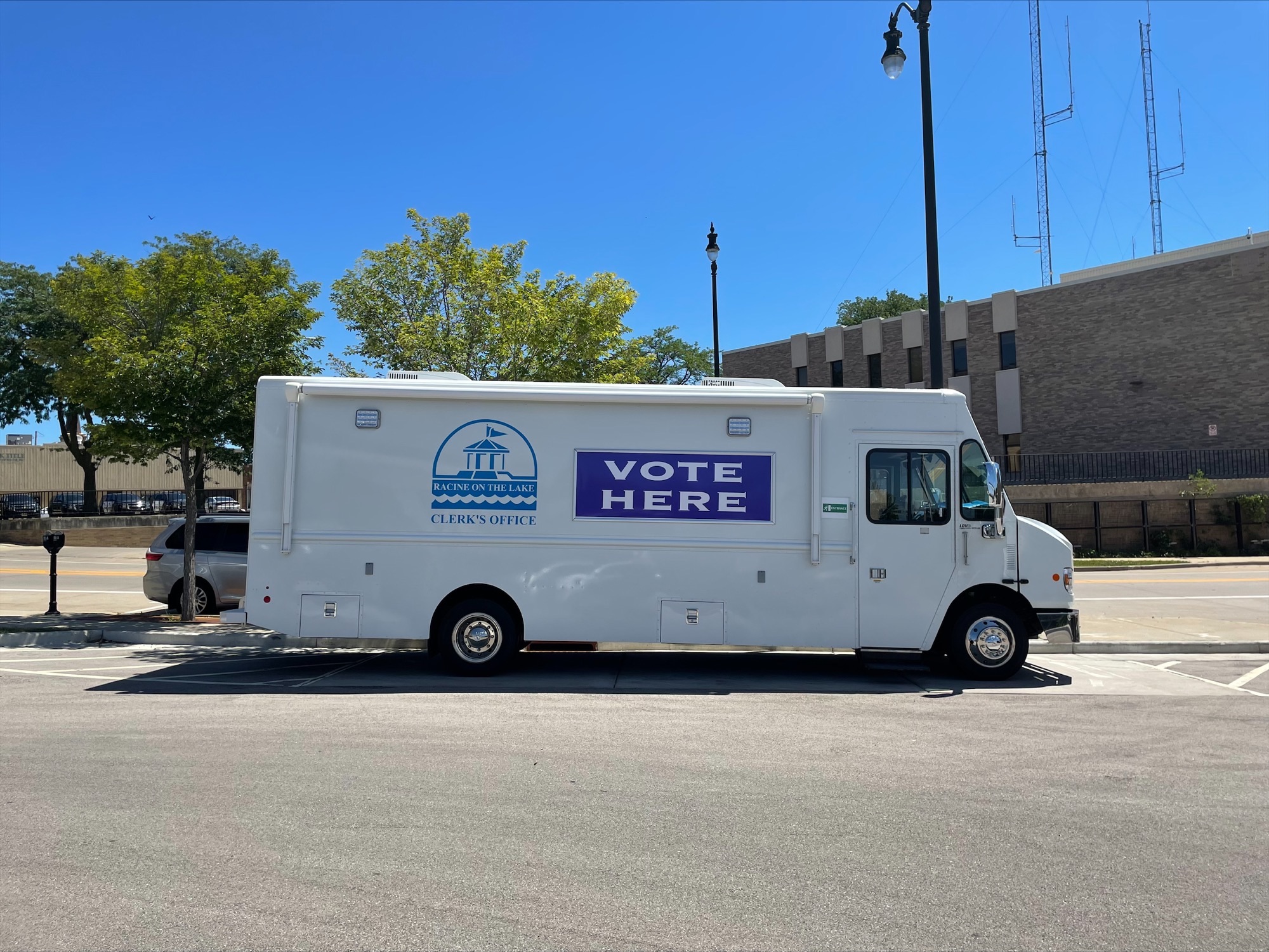 a white truck with the words vote here on the side