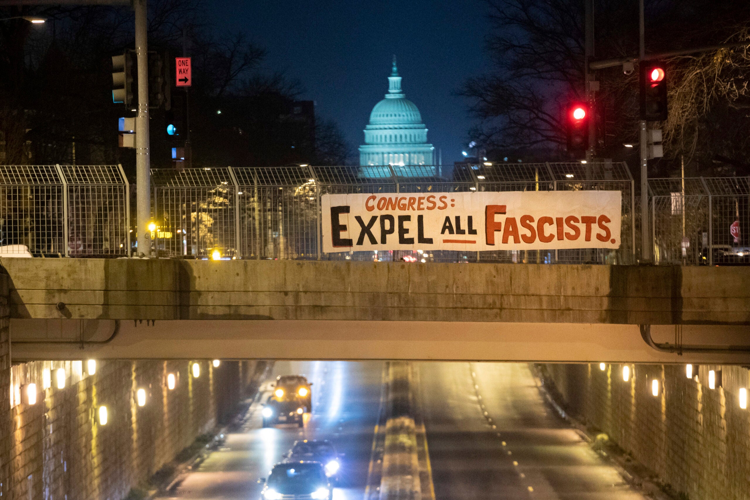 A protest banner draped over a road in Washington, D.C.