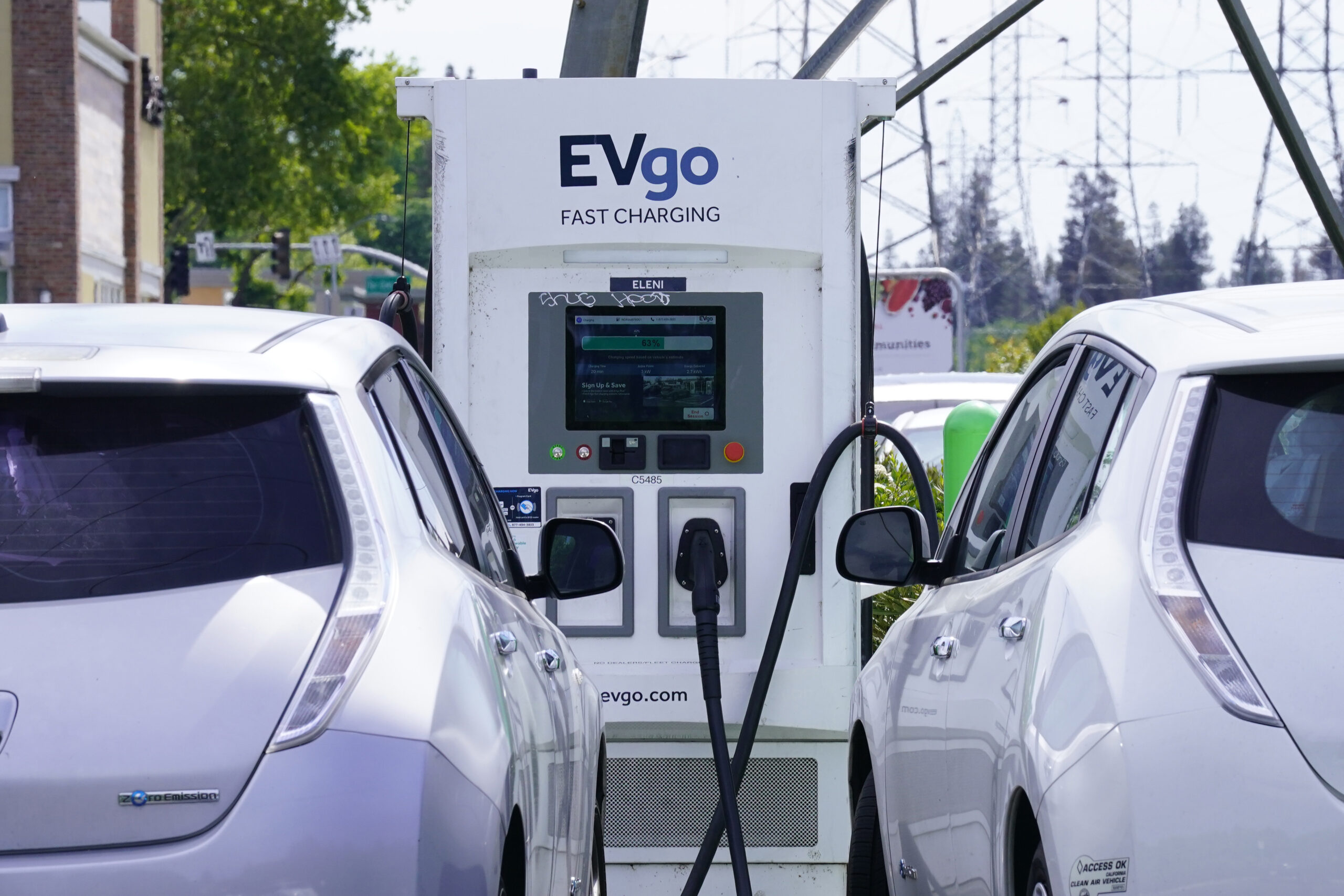 Electric cars are parked at a charging station