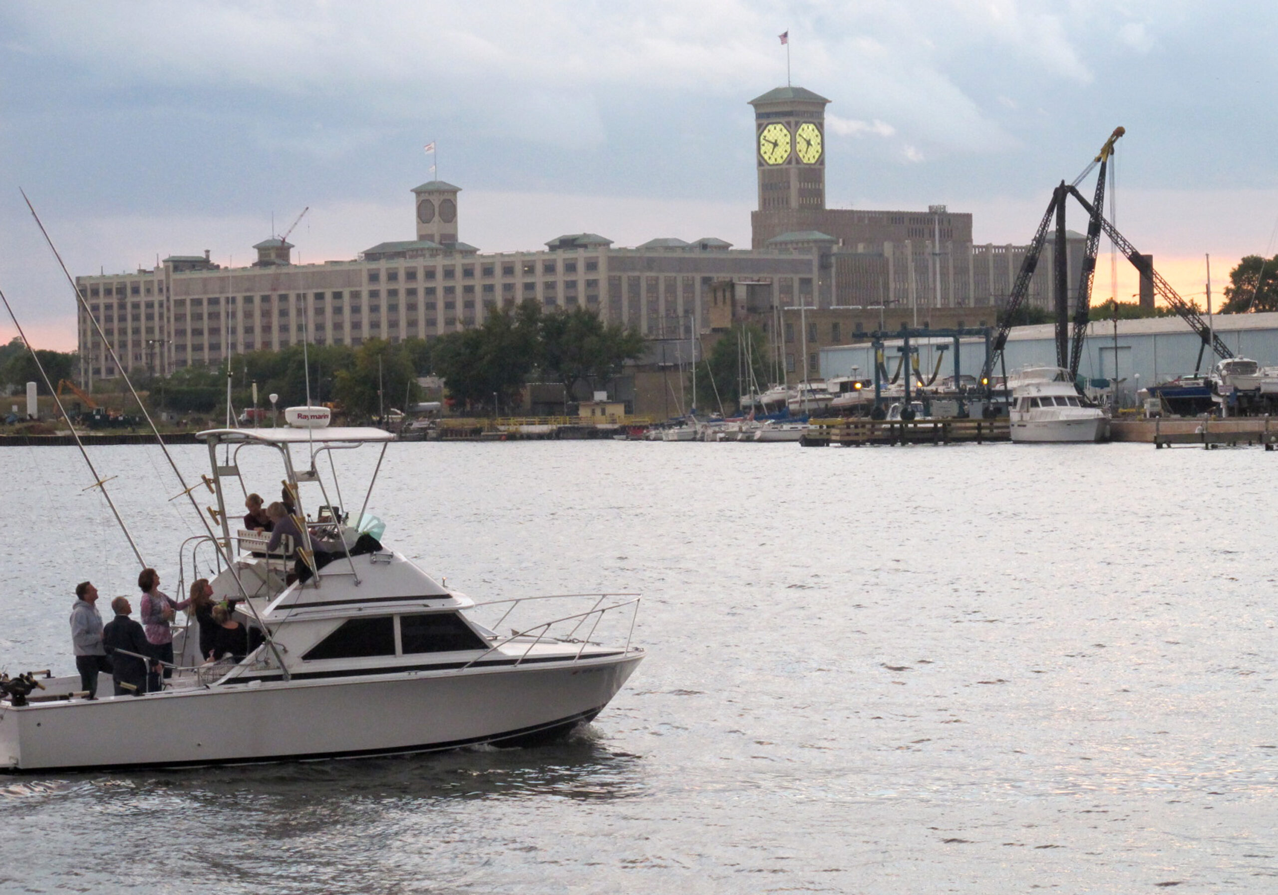 A fishing boat cruises on the Milwaukee River near Lake Michigan.