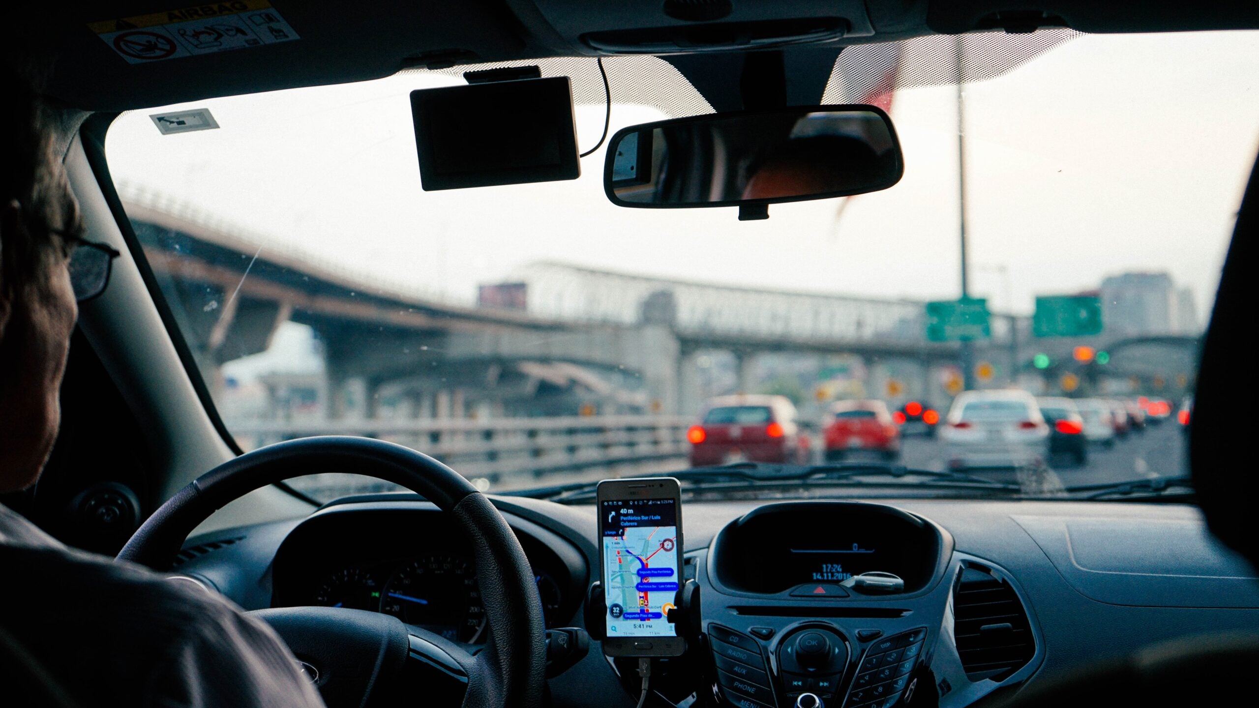 A motorist driving on a busy highway