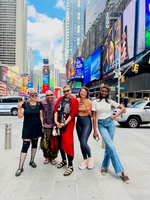 A group from the Edessa School of Fashion poses in Times Square in New York City