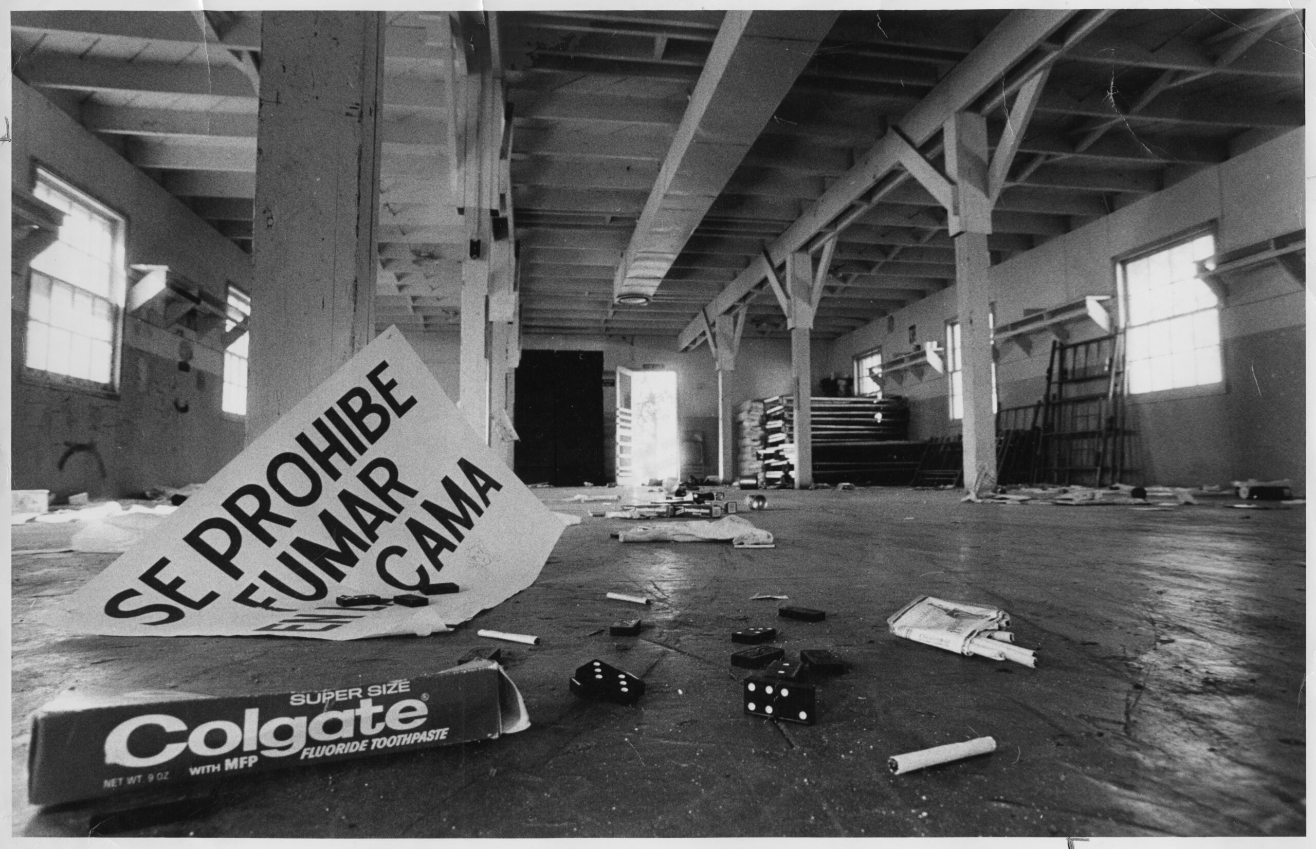 A black and white photograph featuring the single male quarters taken a couple of days after the refugees moved on to Fort Chaffee