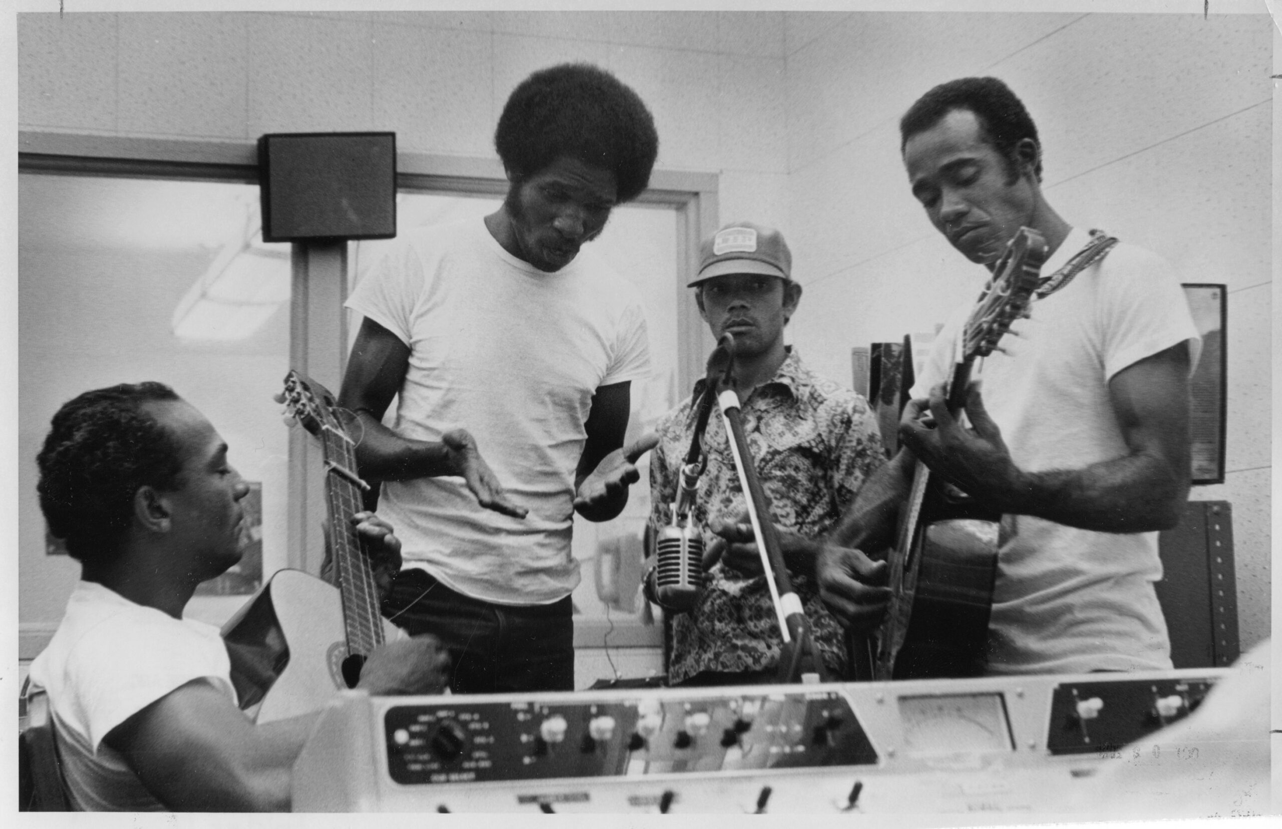 Cuban refugees play music for a radio station broadcast