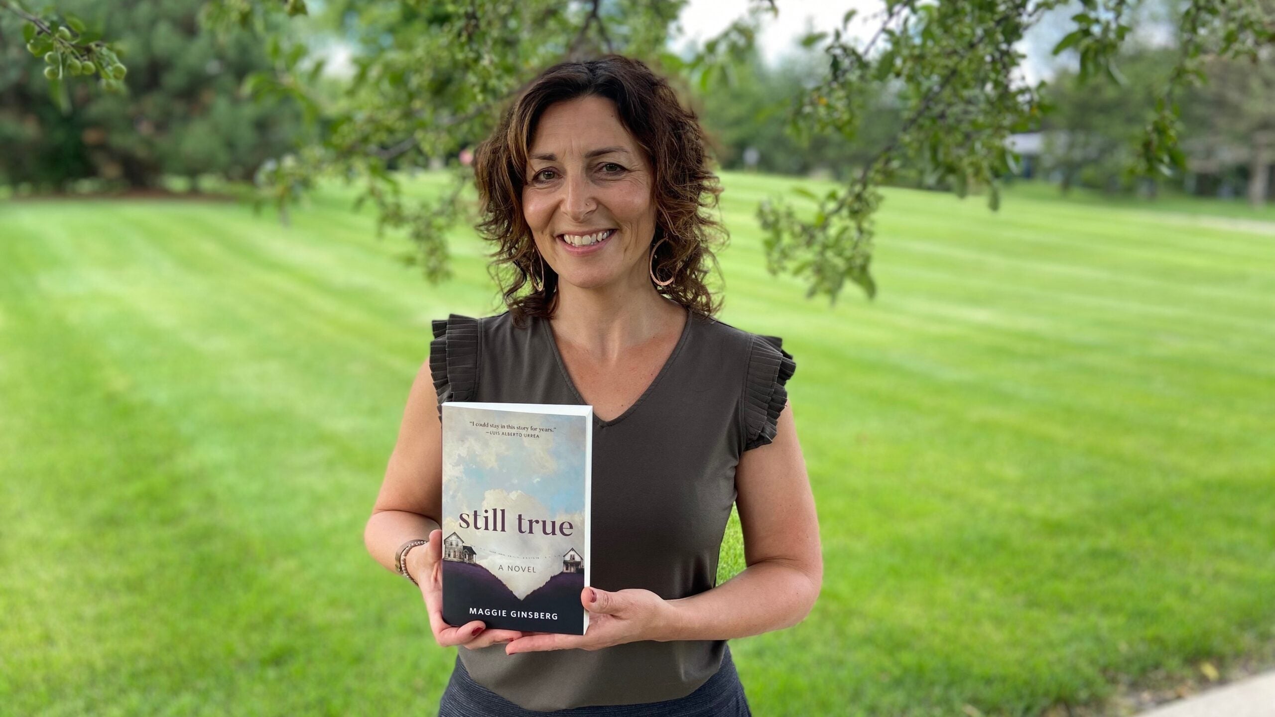 Maggie Ginsberg with her debut novel, "Still True."