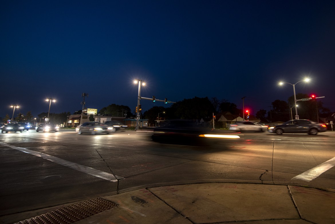 Vehicles drive on West Fond du Lac Avenue at its intersection with West Congress Street in Milwaukee