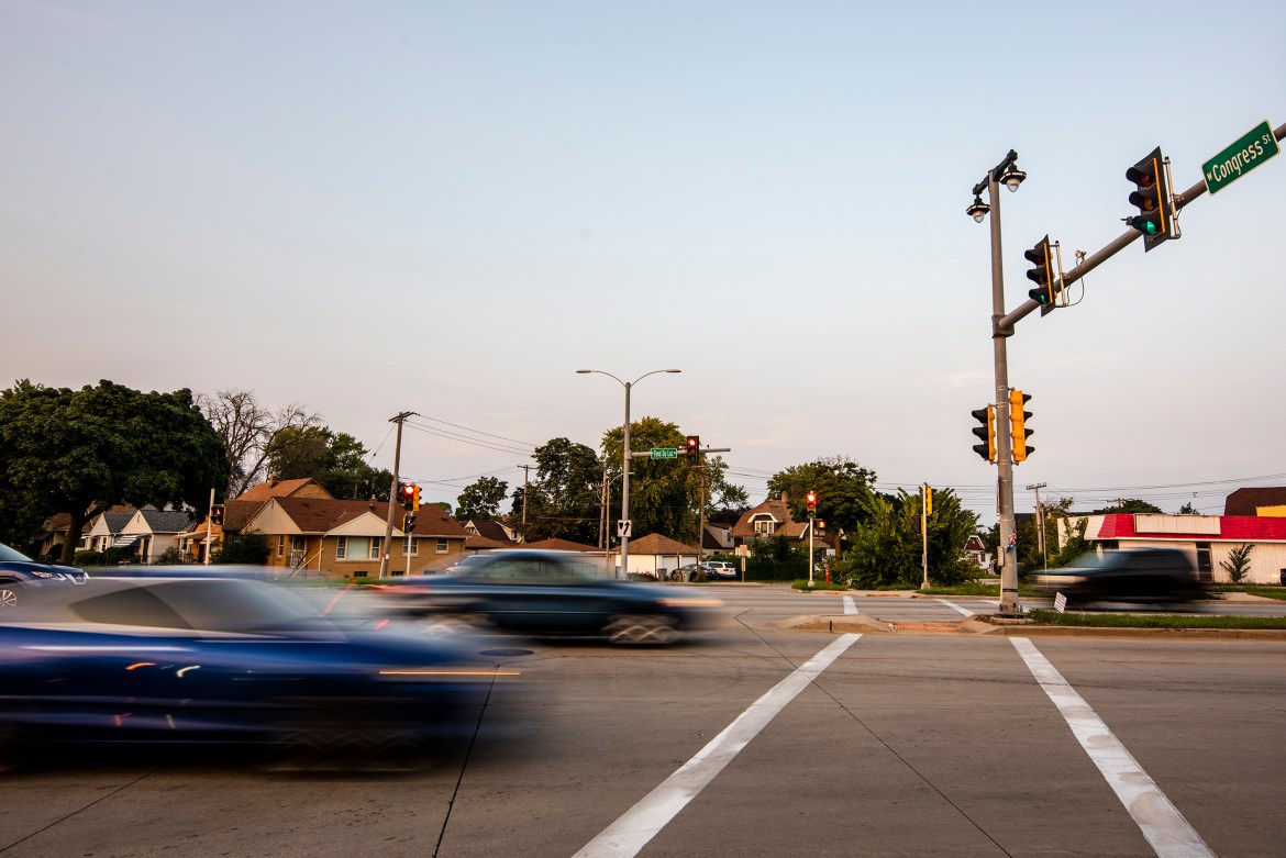 Vehicles drive on West Fond du Lac Avenue at its intersection with West Congress Street in Milwaukee