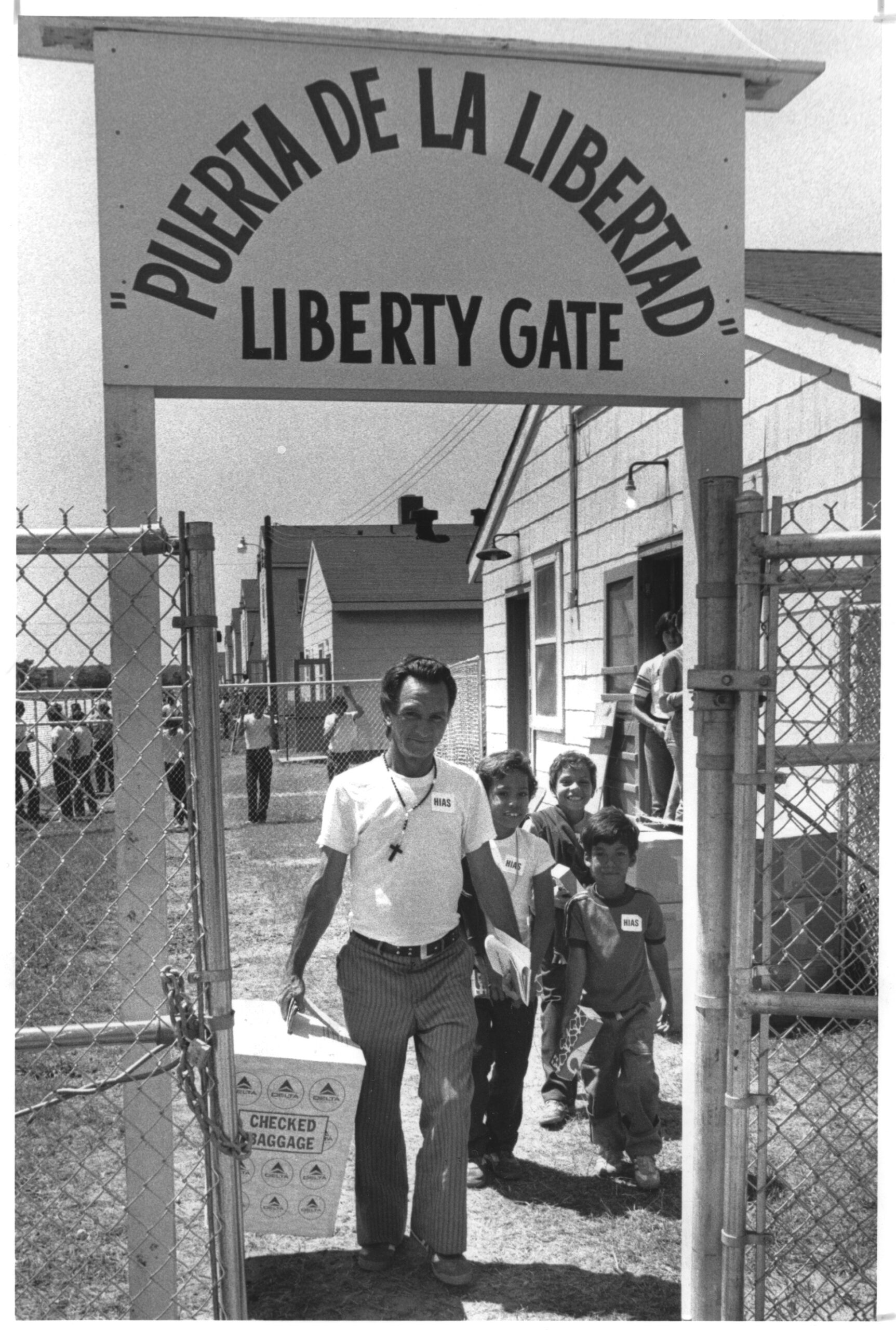 A black and white photograph of Miguel Tamayo and his family leaving Fort McCoy