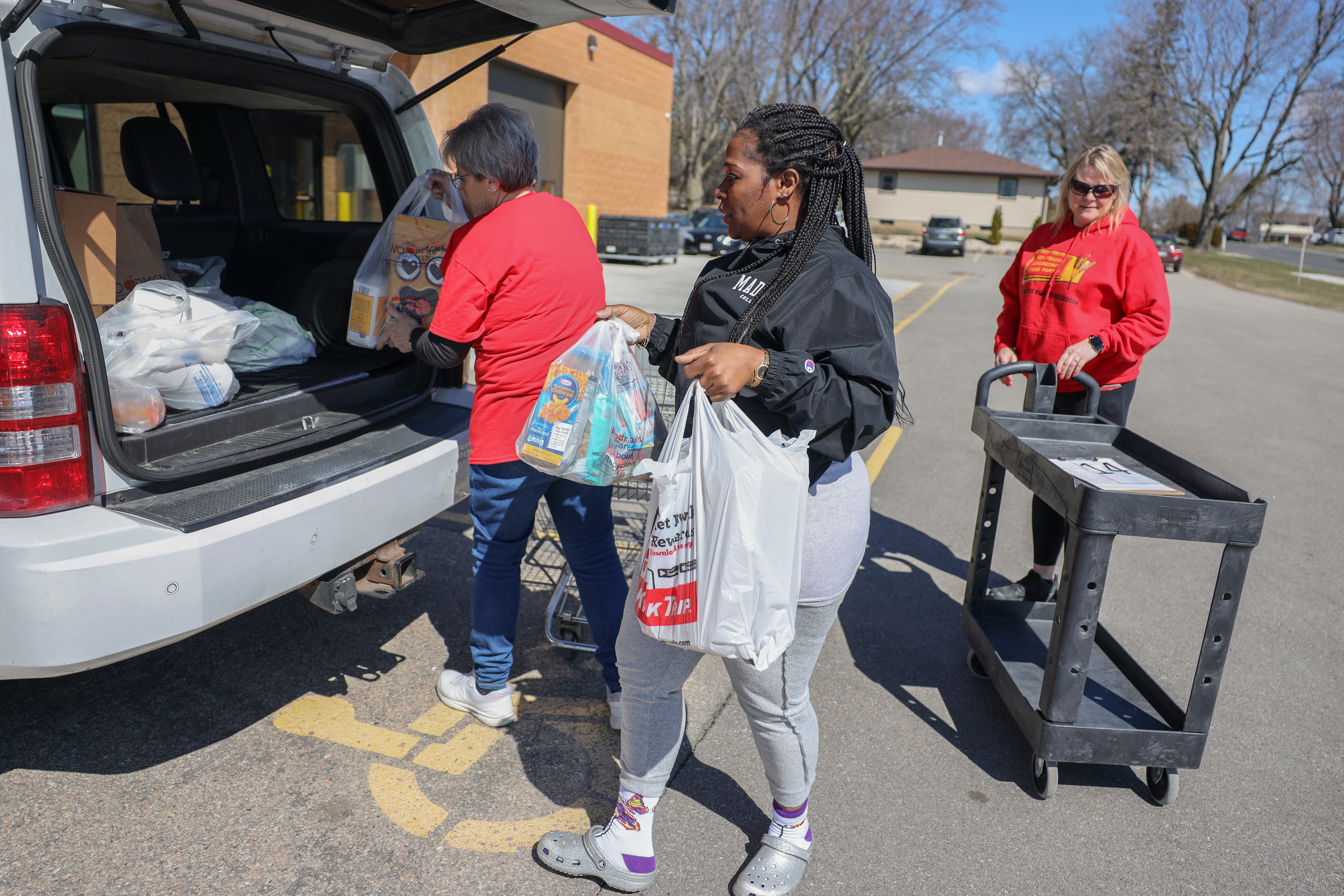 Margaret Benton loads groceries at the Sun Prairie Emergency Food Pantry in Sun Prairie